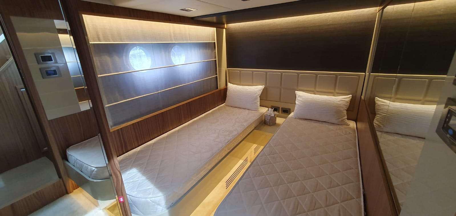 a room with a bed and a window aboard ABSOLUTE Yacht for Charter