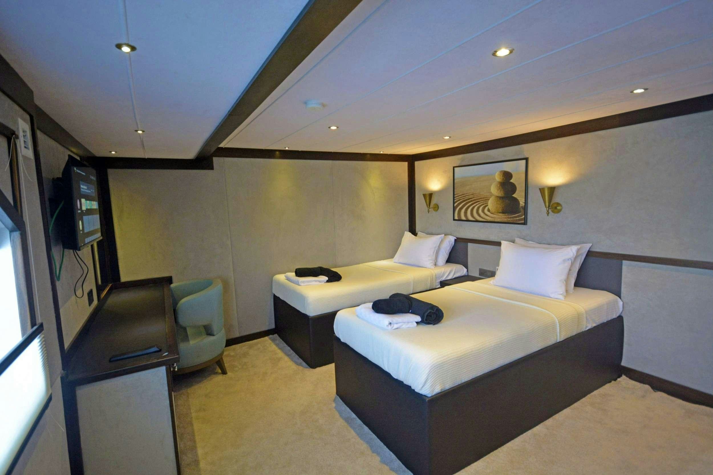 a room with two beds aboard NAYK 3 Yacht for Charter