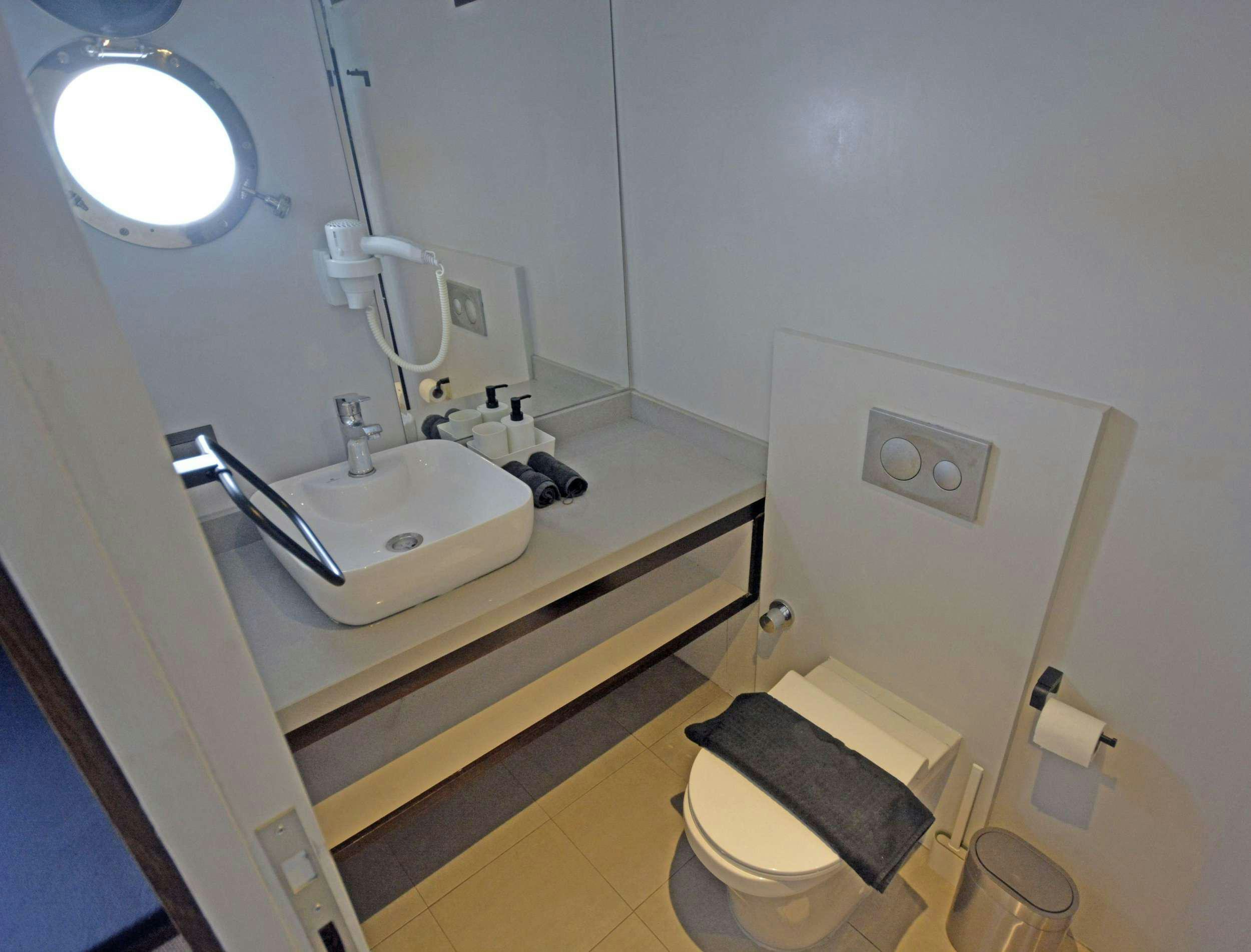 a bathroom with a sink and a toilet aboard NAYK 3 Yacht for Charter