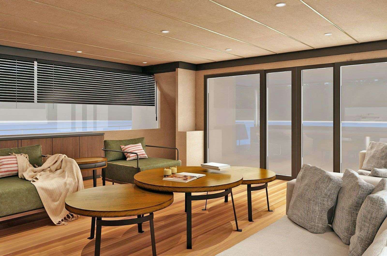 a living room with a couch and a table aboard NAYK 3 Yacht for Charter