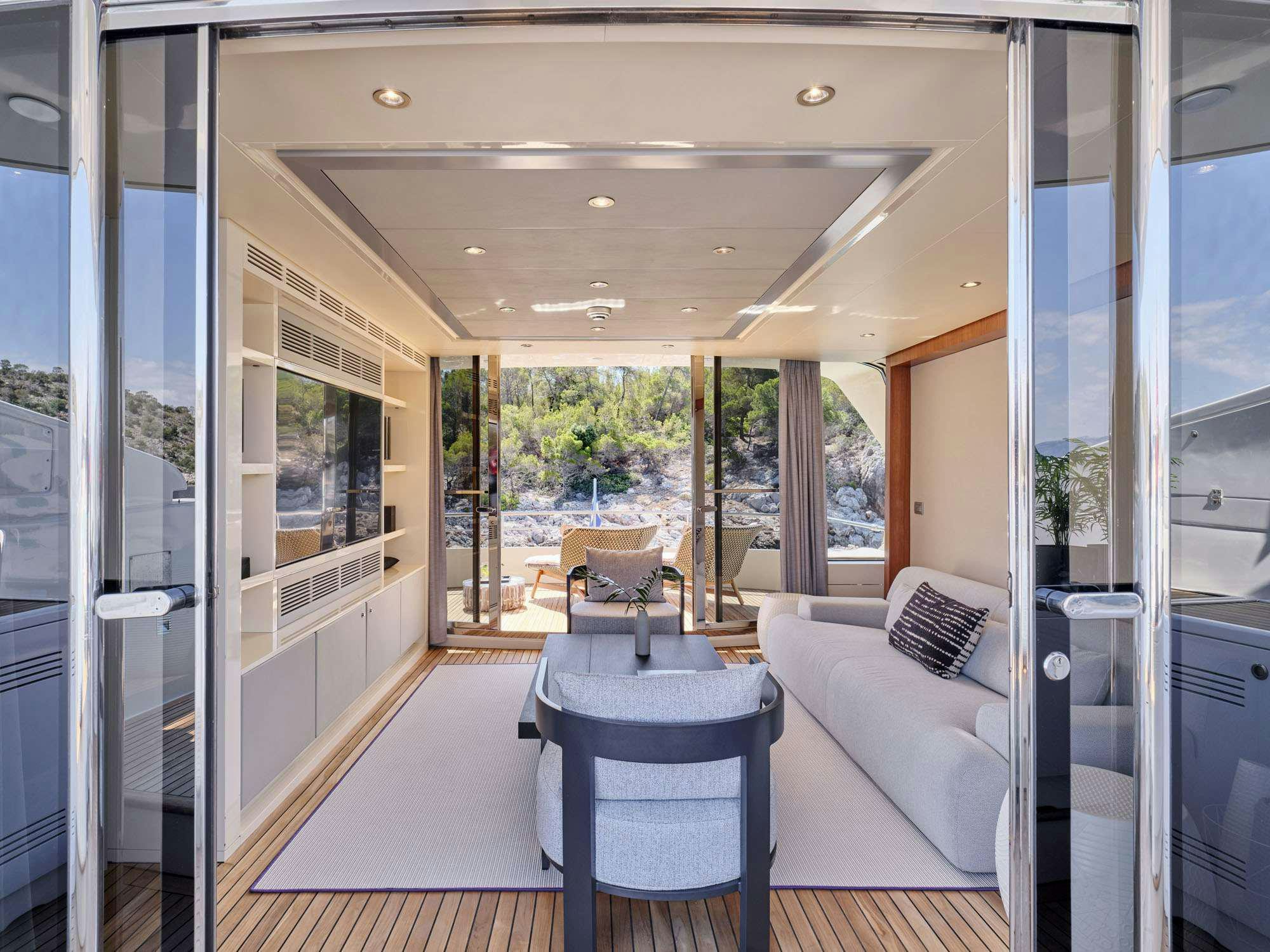 a room with a table and chairs aboard BEYOND Yacht for Charter