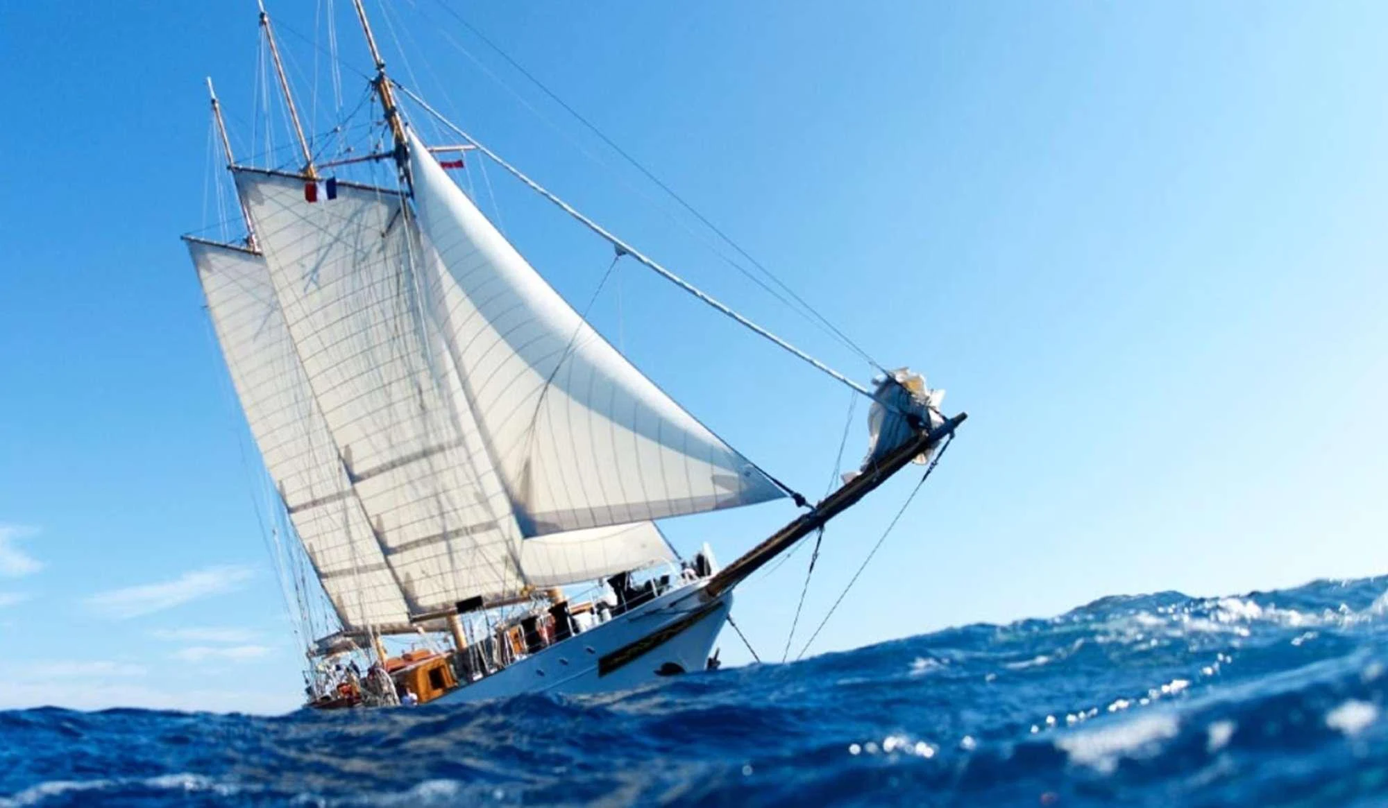 a man on a sailboat aboard TRINAKRIA Yacht for Charter