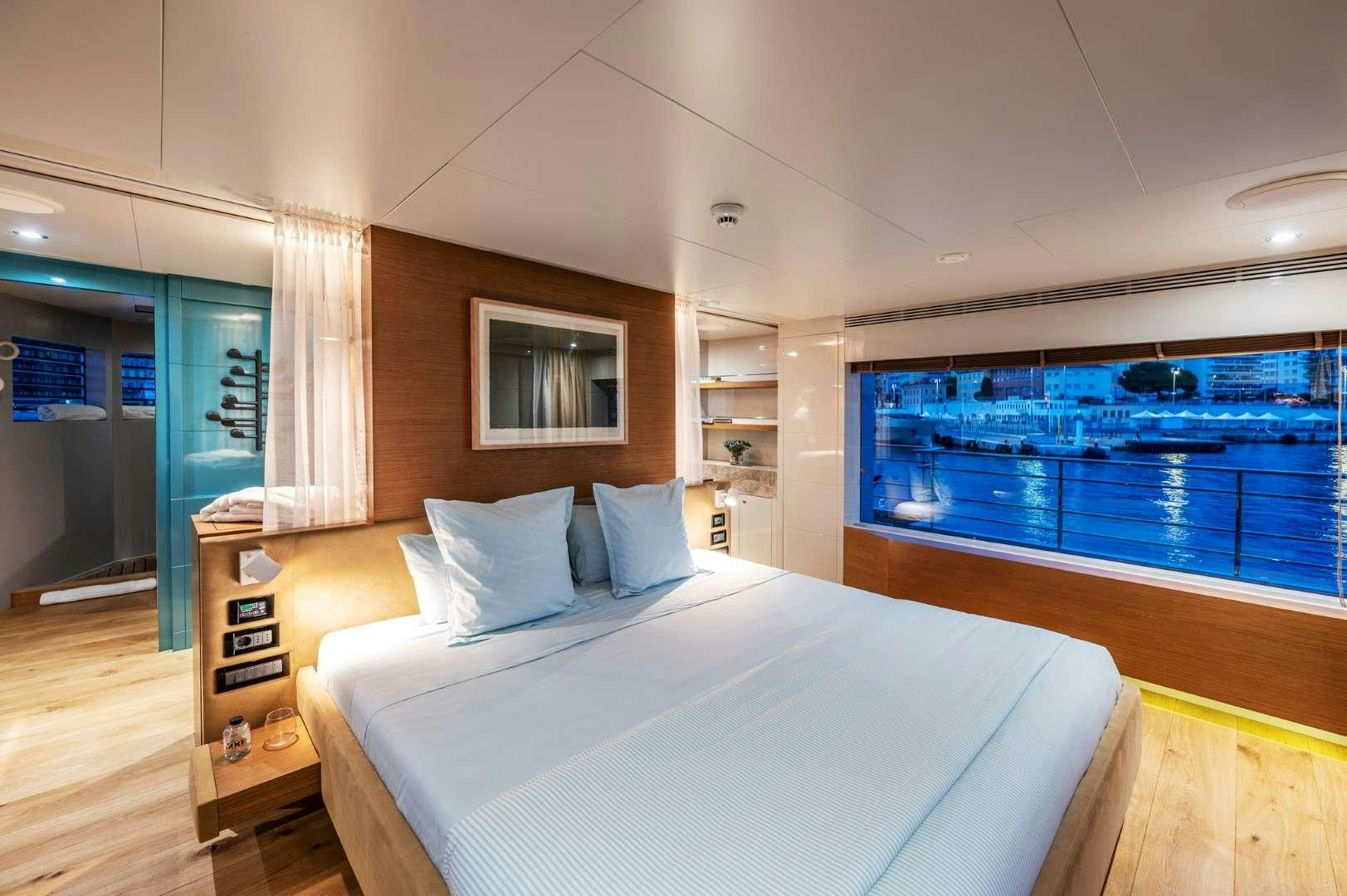 a bed in a room aboard SO'MAR Yacht for Charter