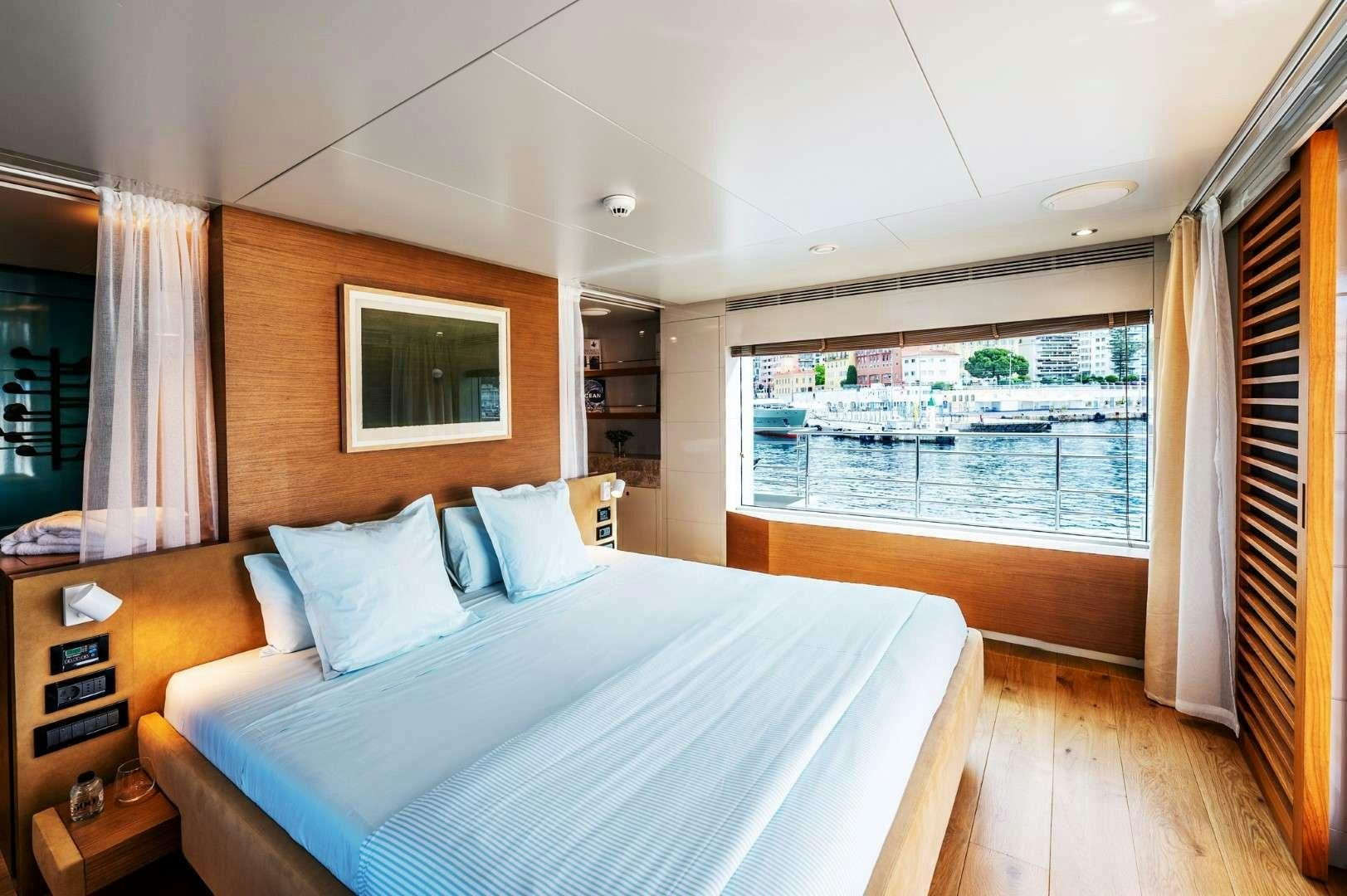 a bed in a room aboard SO'MAR Yacht for Charter