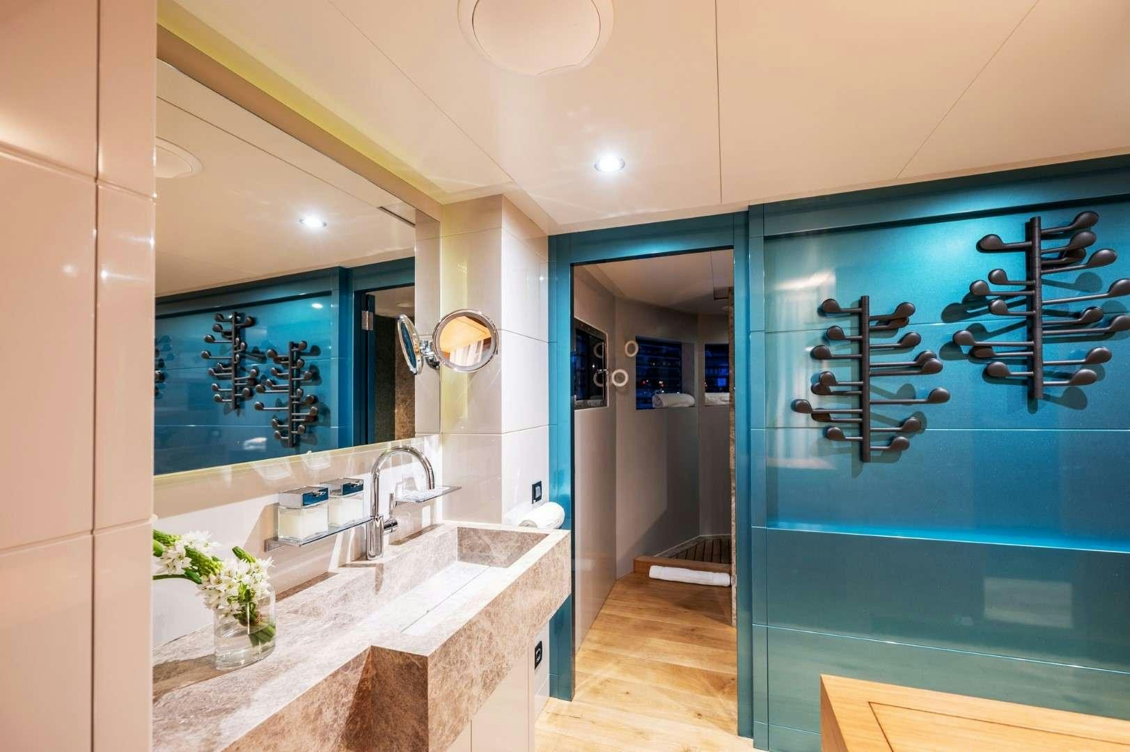 a bathroom with a large mirror aboard SO'MAR Yacht for Charter