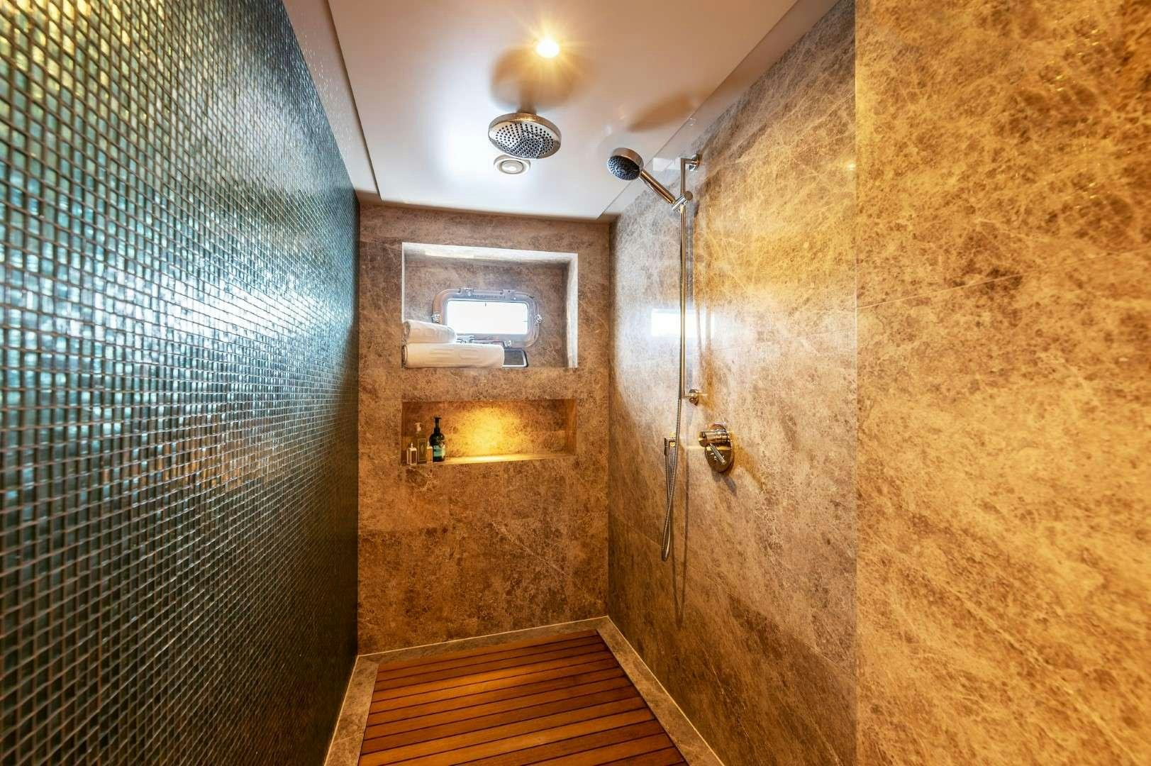 a bathroom with a shower and a sink aboard SO'MAR Yacht for Charter