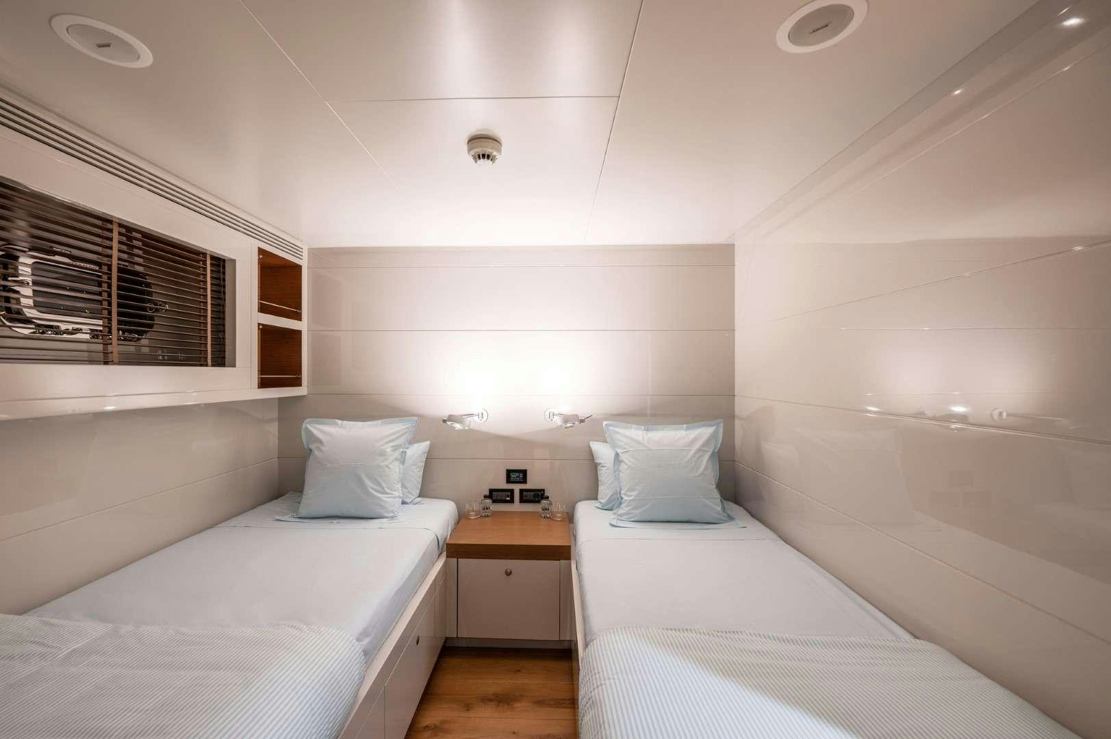 a room with two beds aboard SO'MAR Yacht for Charter