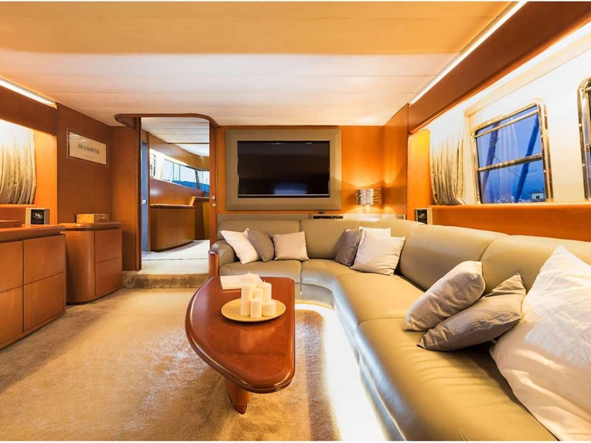 a living room with a large window aboard CLAUDIA AMBER Yacht for Charter