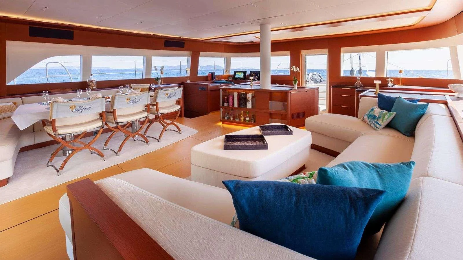 The salon offers a spacious and luxurious seating area with panoramic views. aboard NEFESH Yacht for Charter