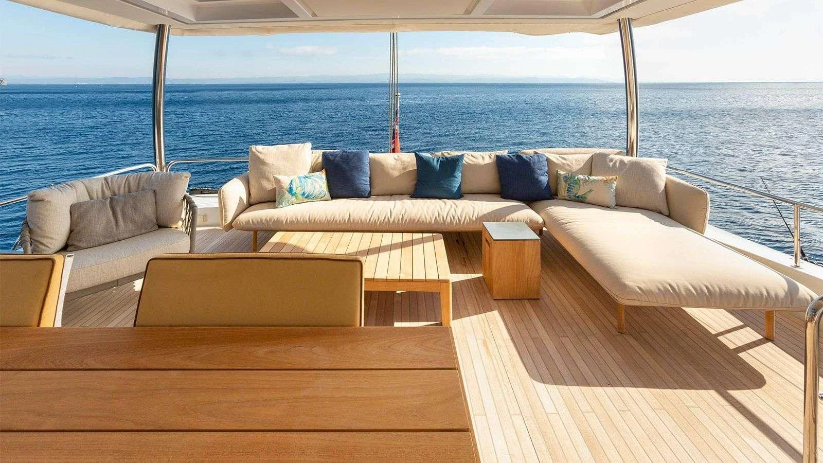 The aft deck offers a spacious and inviting seating area with panoramic ocean views. aboard NEFESH Yacht for Charter