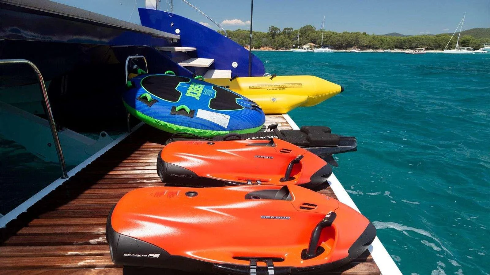 The yacht's swim platform is equipped with various water toys, including sea scooters and inflatable towables, perfect for aquatic adventures. aboard NEFESH Yacht for Charter