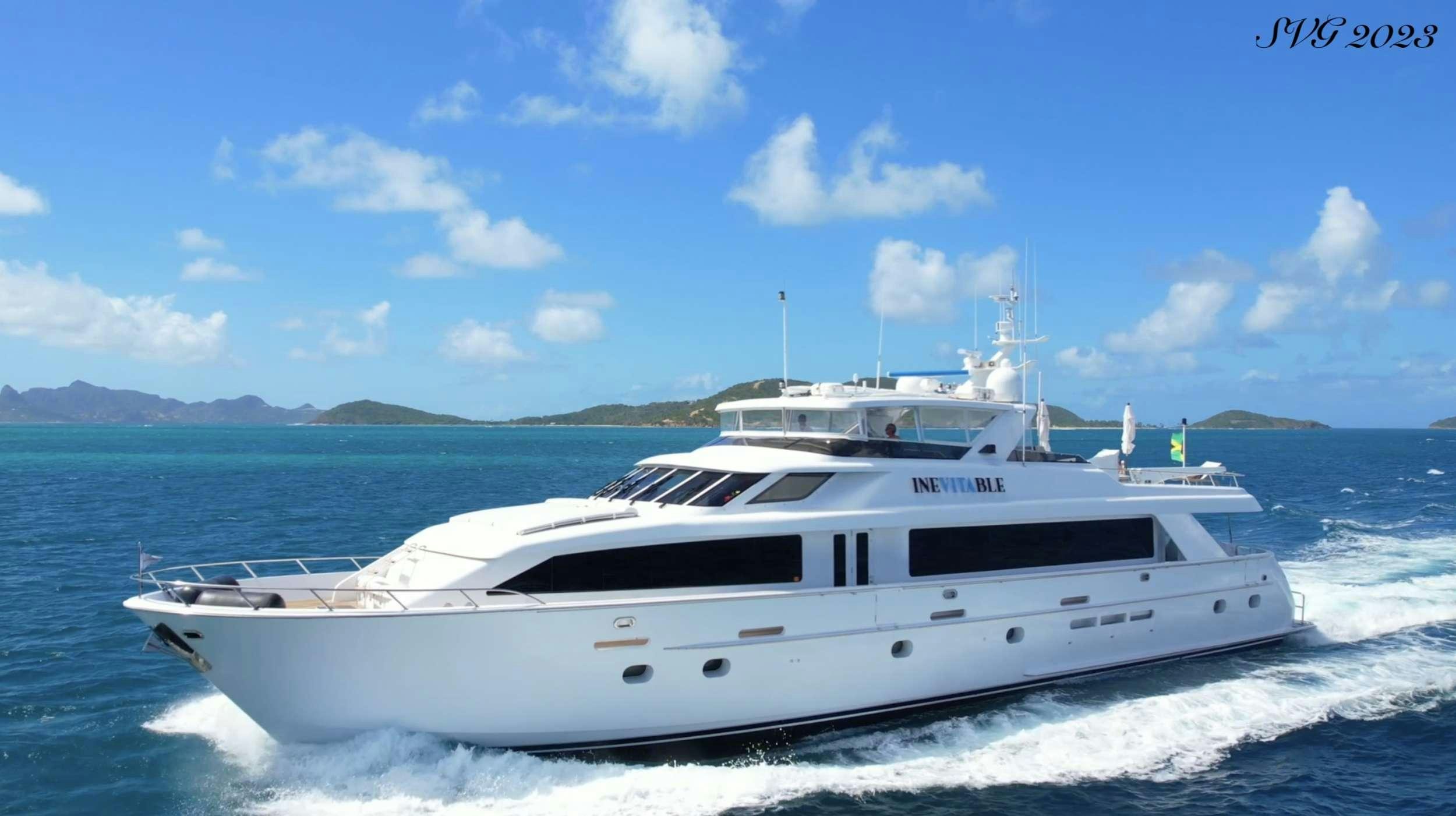 a white yacht on the water aboard INEVITABLE Yacht for Charter