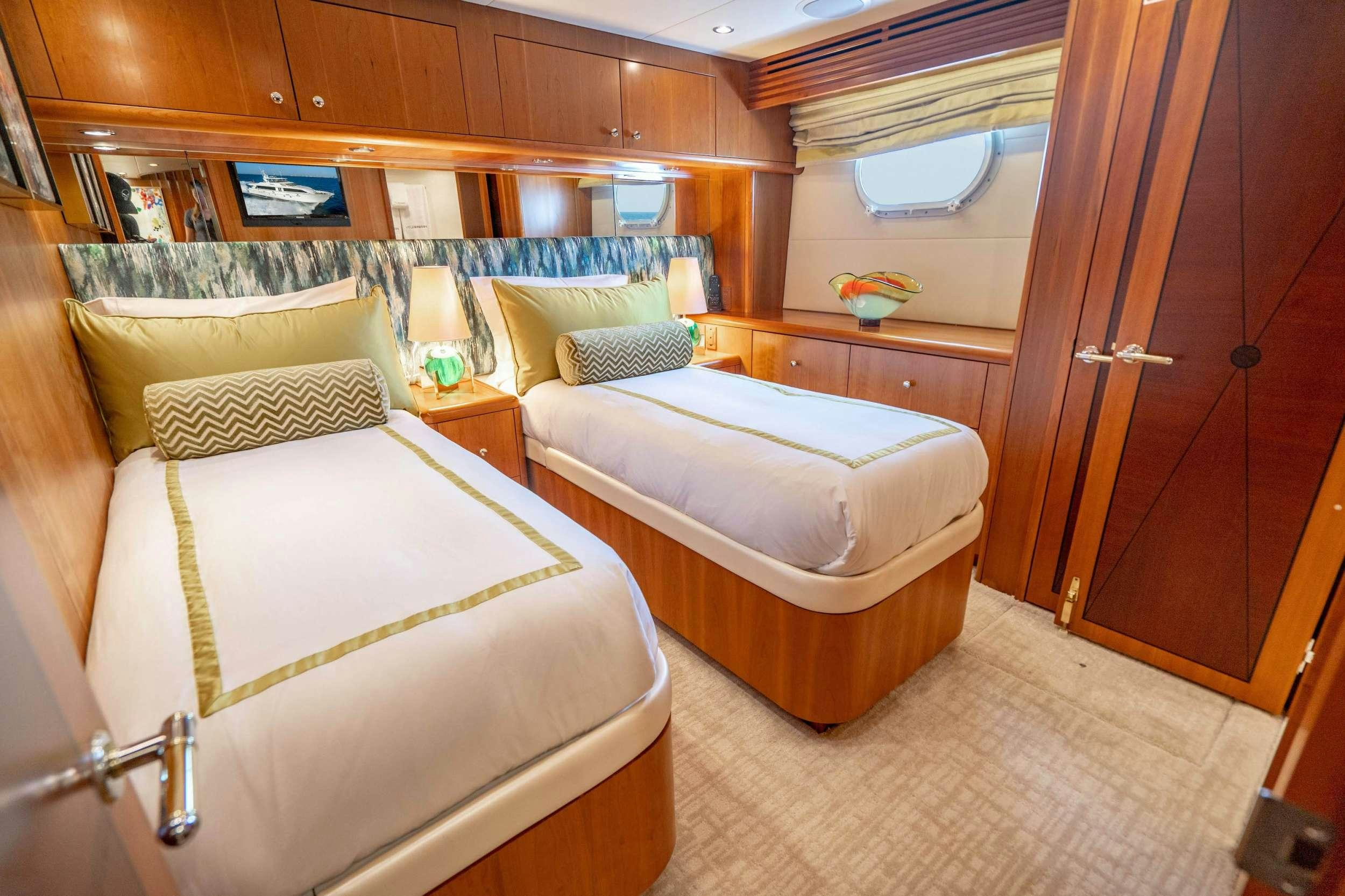a room with two beds aboard INEVITABLE Yacht for Charter