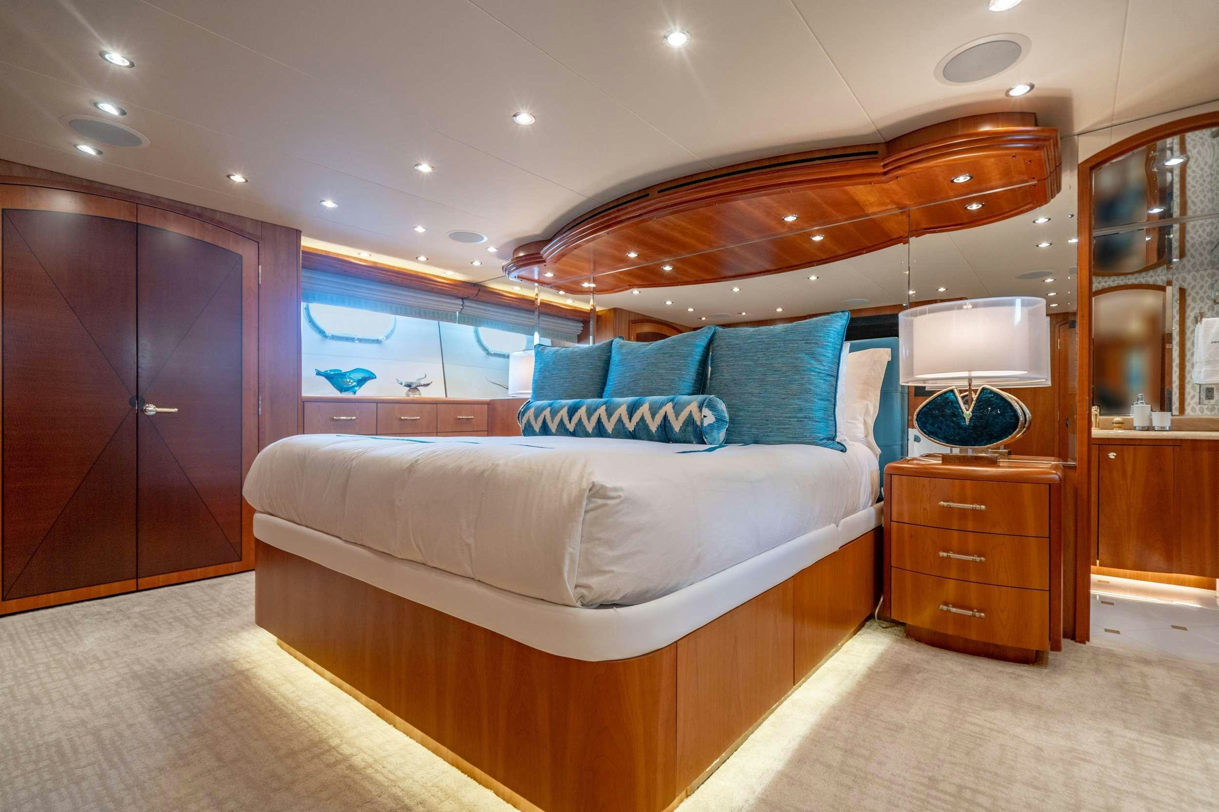 a bed in a room aboard INEVITABLE Yacht for Charter