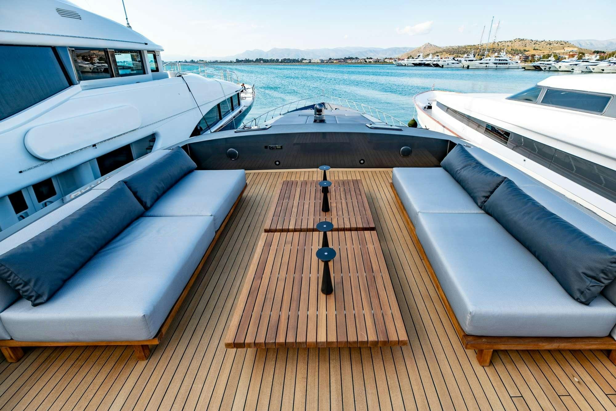 a deck with a boat and a large body of water aboard EVA Yacht for Charter