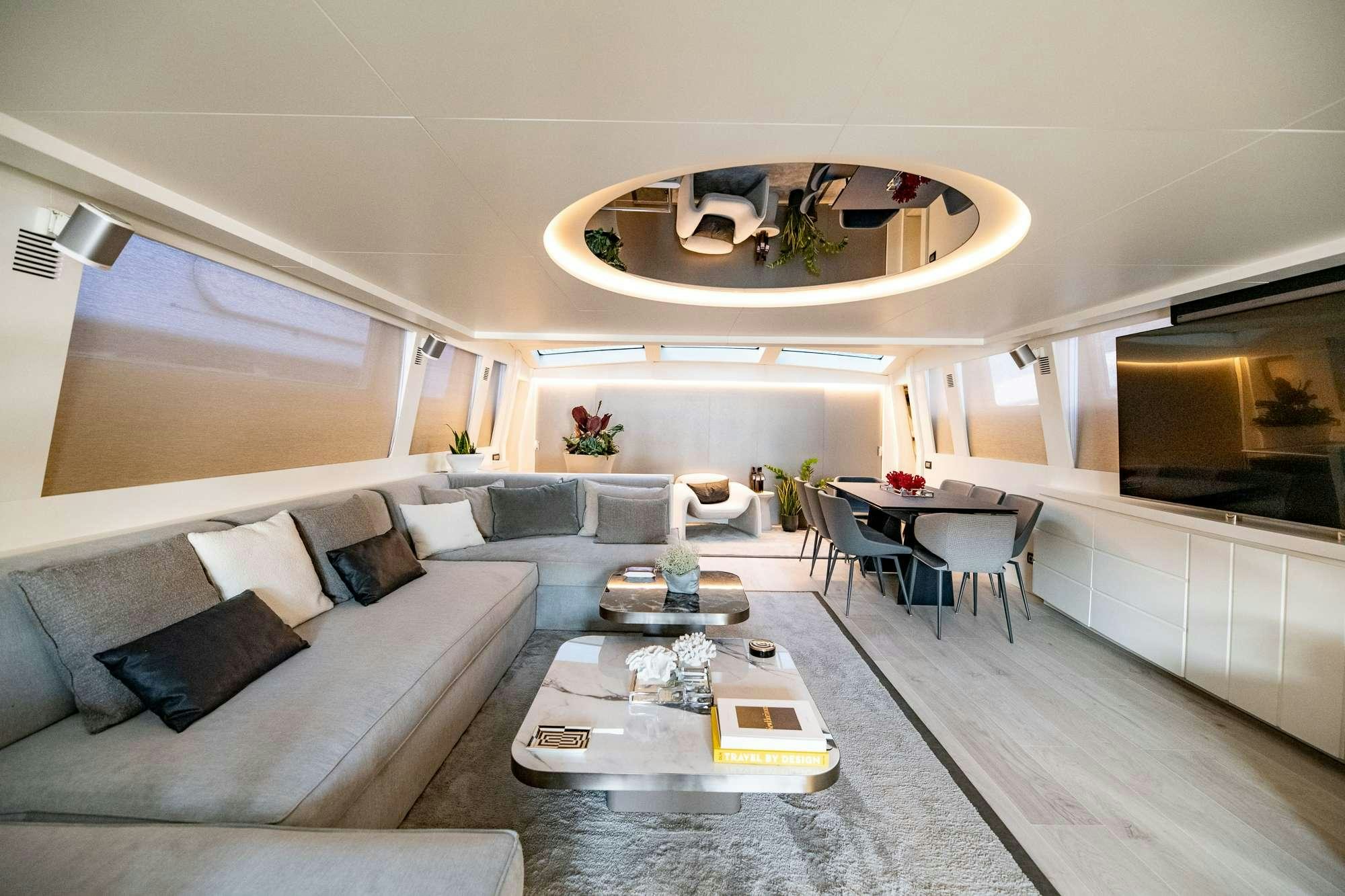 a living room with a couch and a table aboard EVA Yacht for Charter