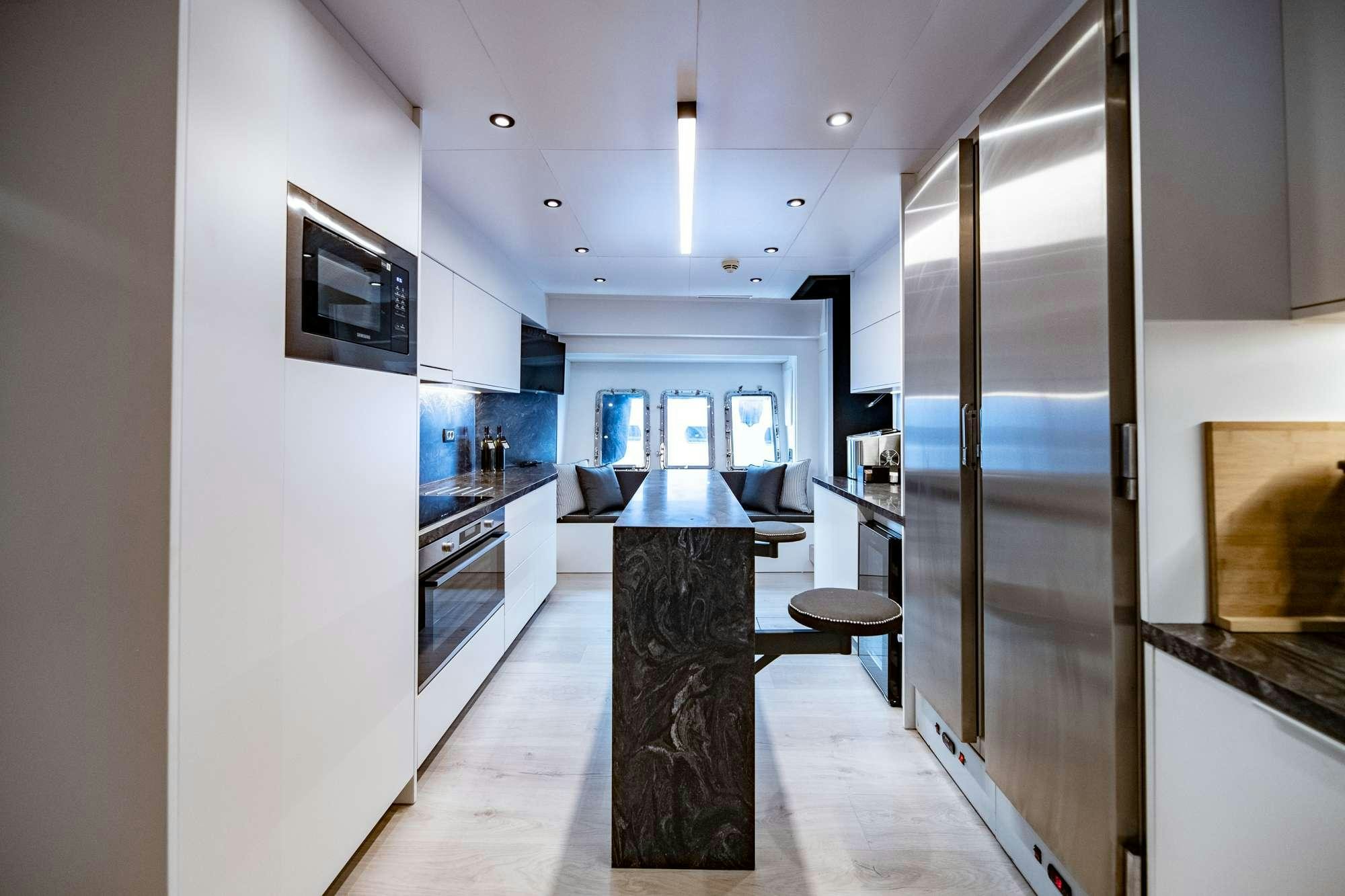 a kitchen with a large glass door aboard EVA Yacht for Charter