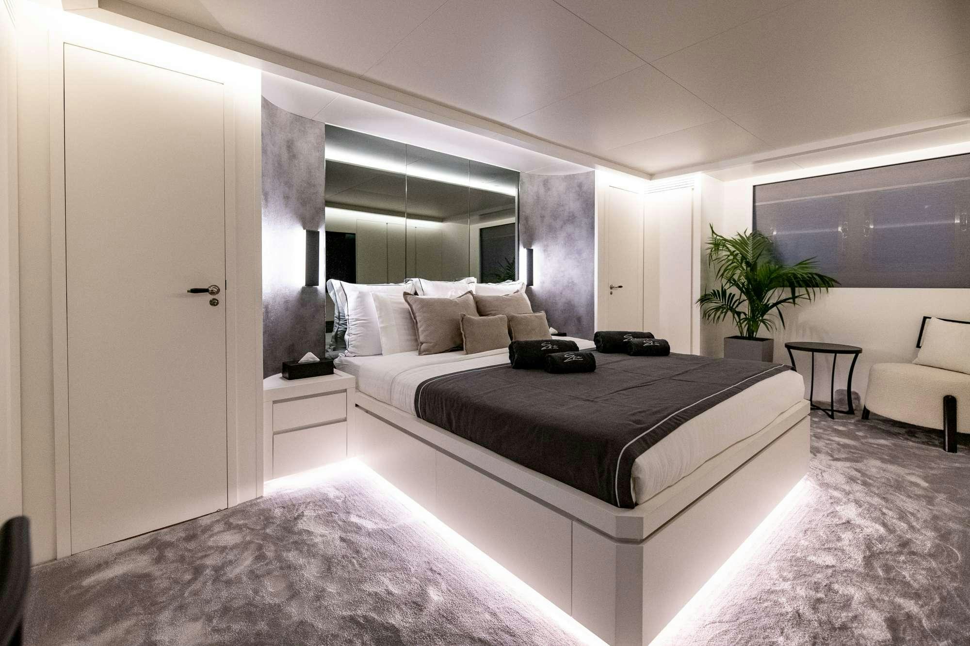 a large bedroom with a large bed aboard EVA Yacht for Charter