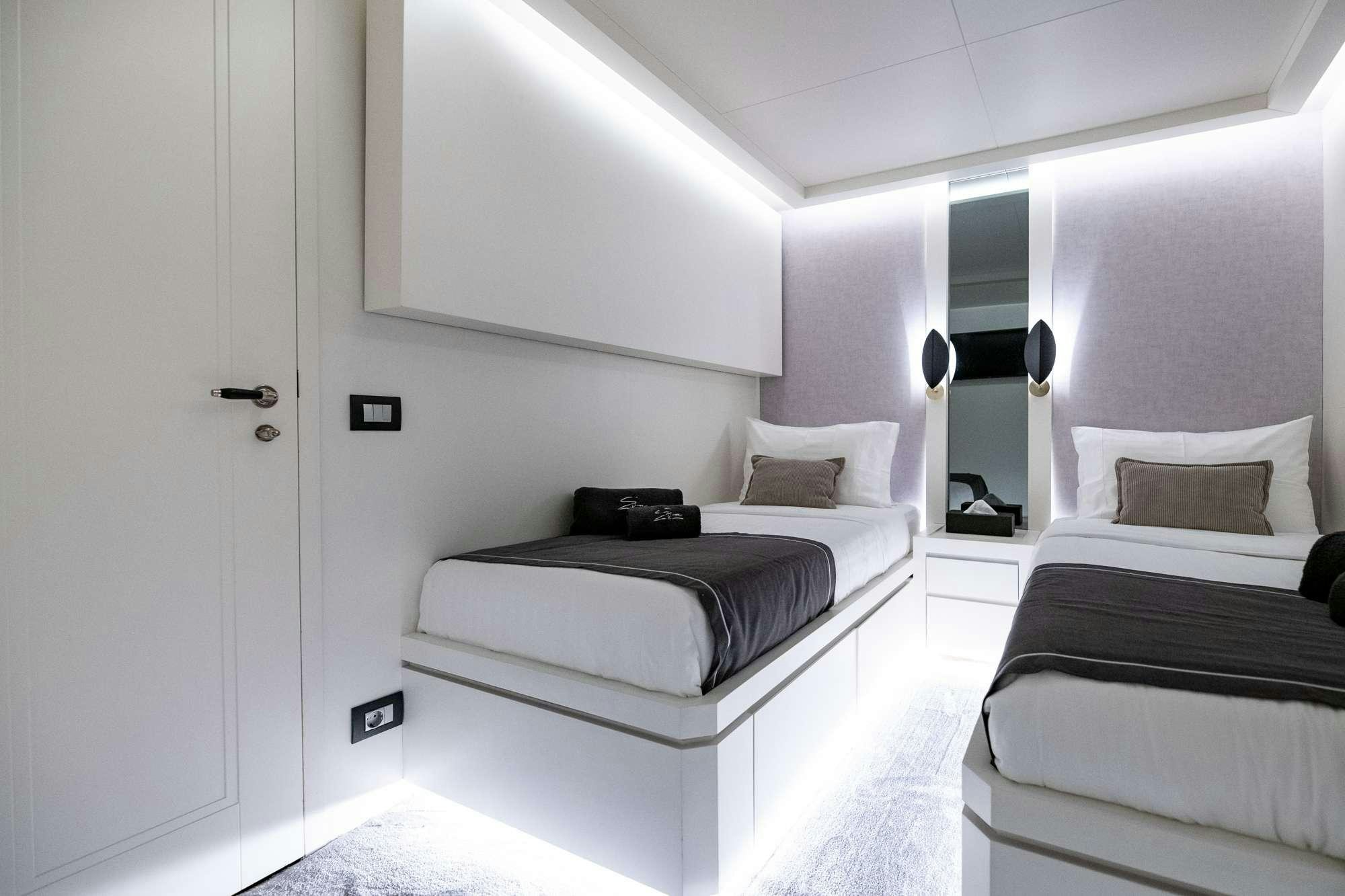 a room with two beds aboard EVA Yacht for Charter