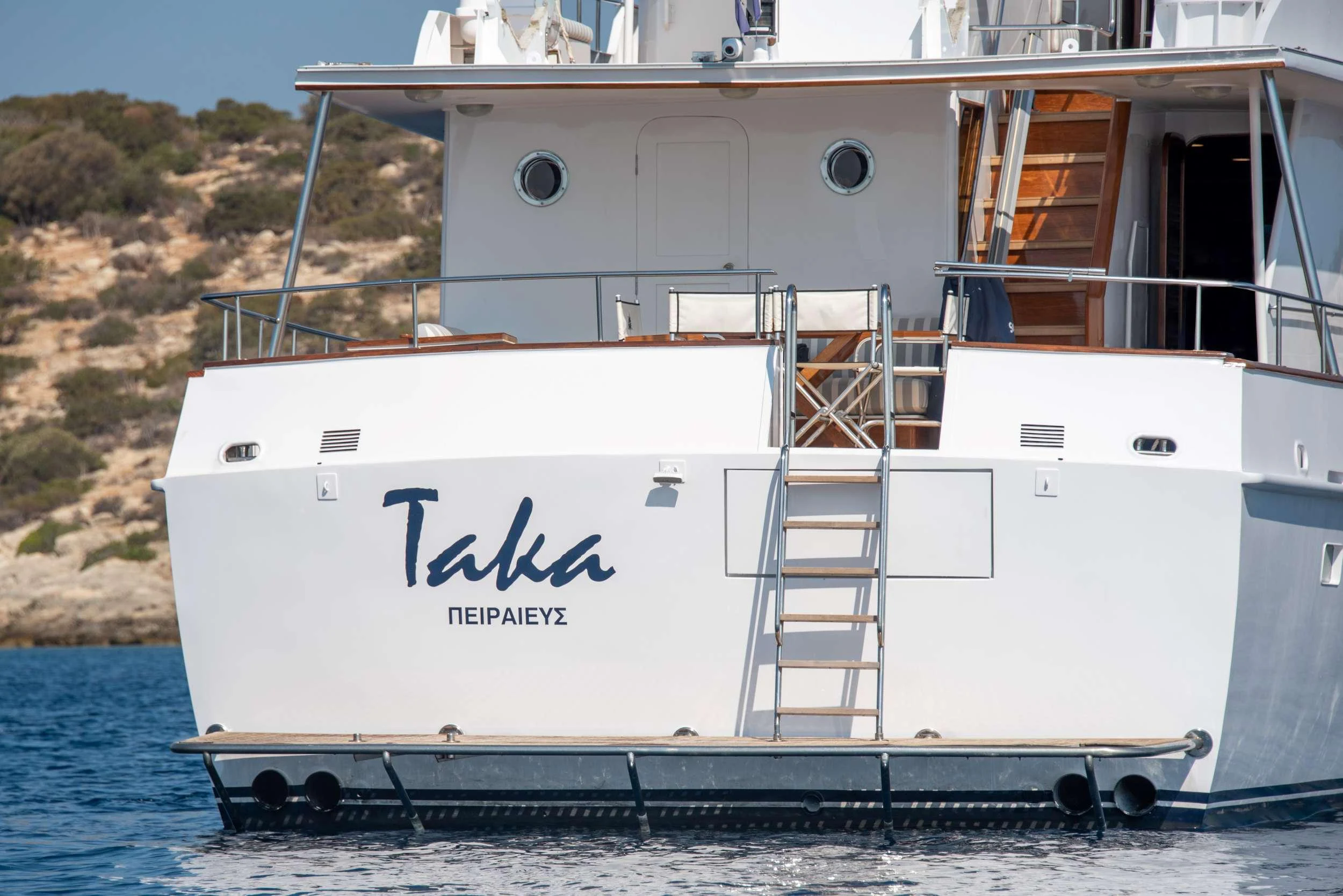 a white boat on the water aboard TAKA Yacht for Charter