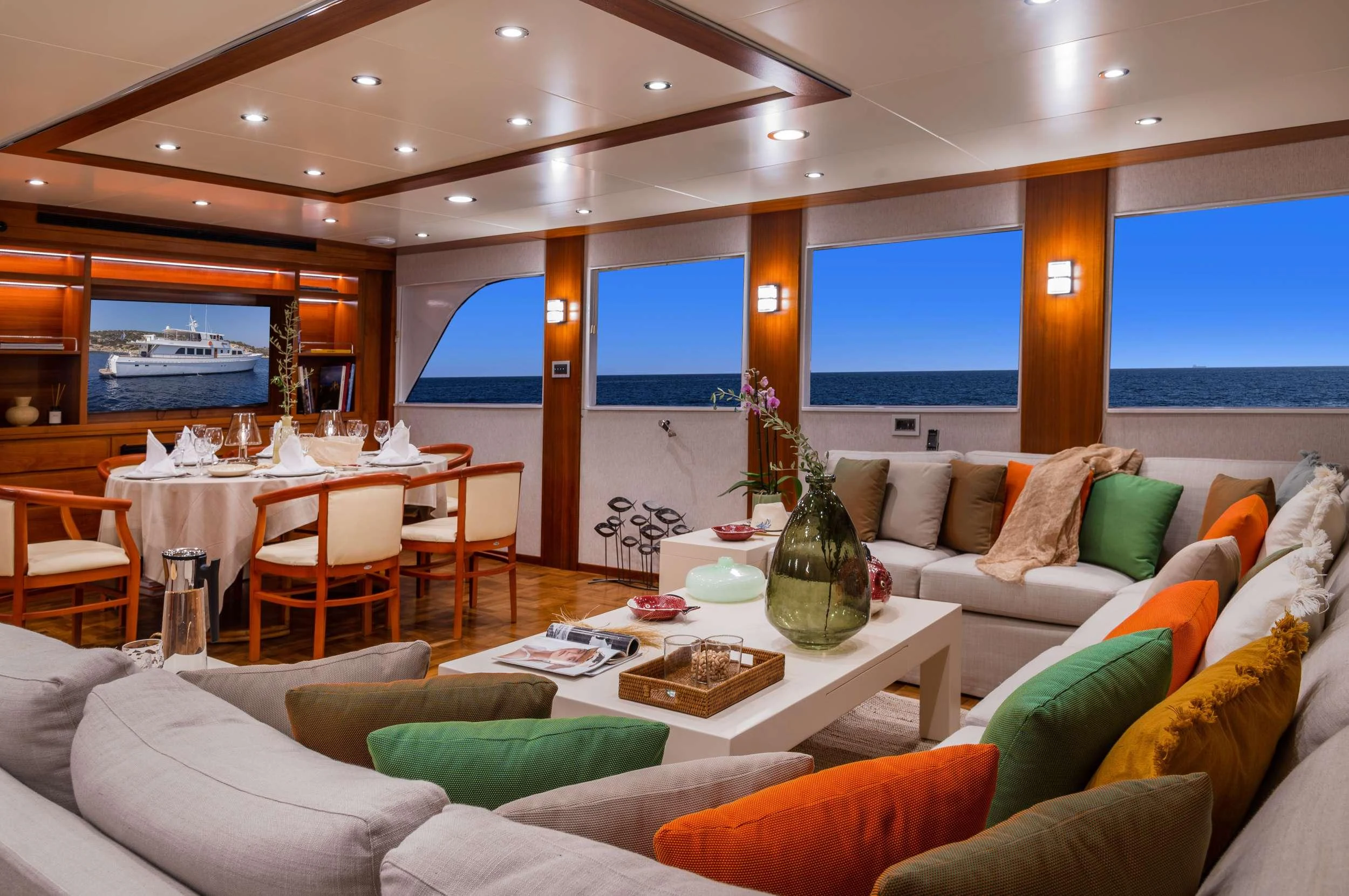 a living room with a large window aboard TAKA Yacht for Charter