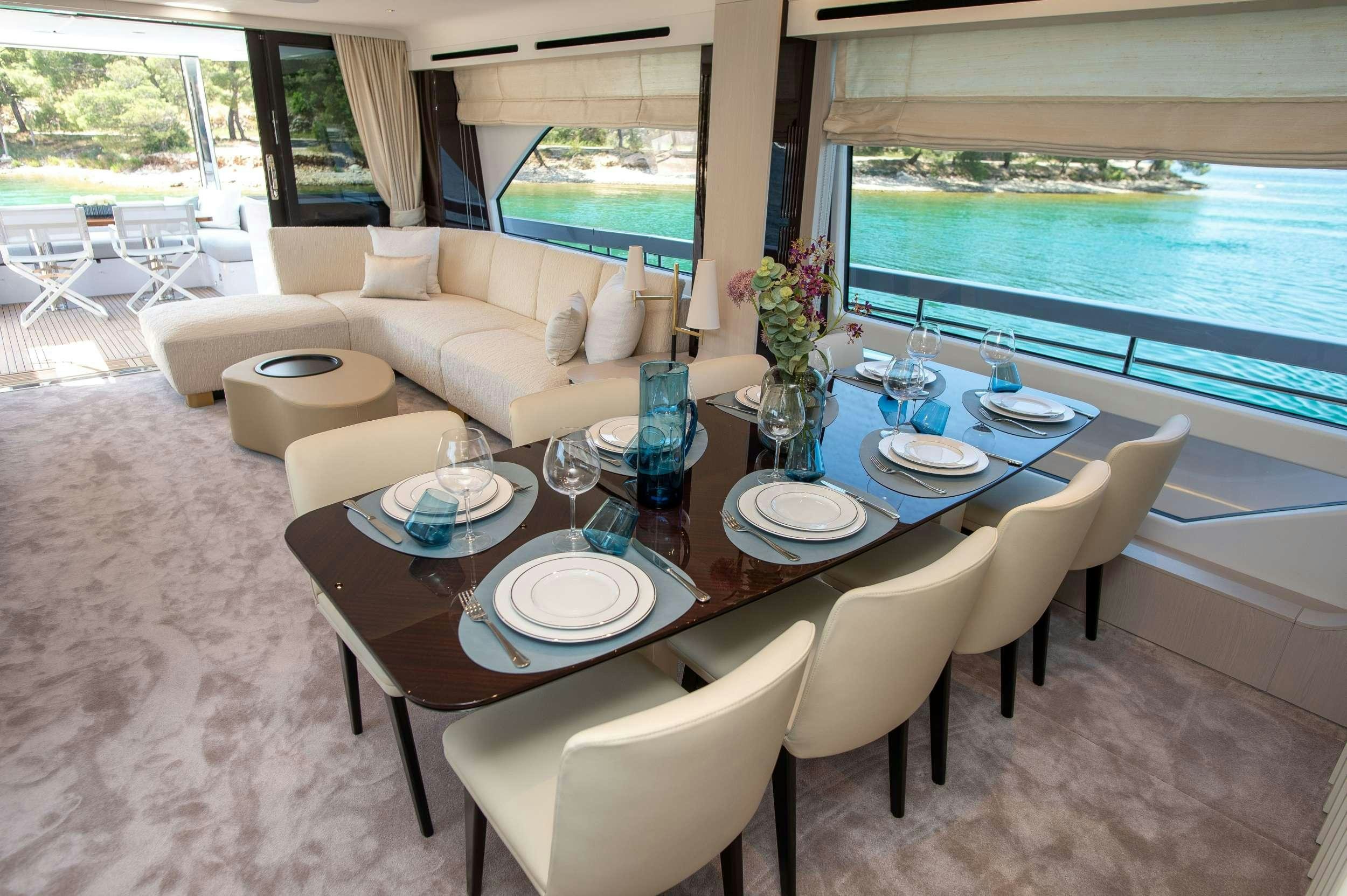 a dining room with a table and chairs aboard PREWI Yacht for Charter