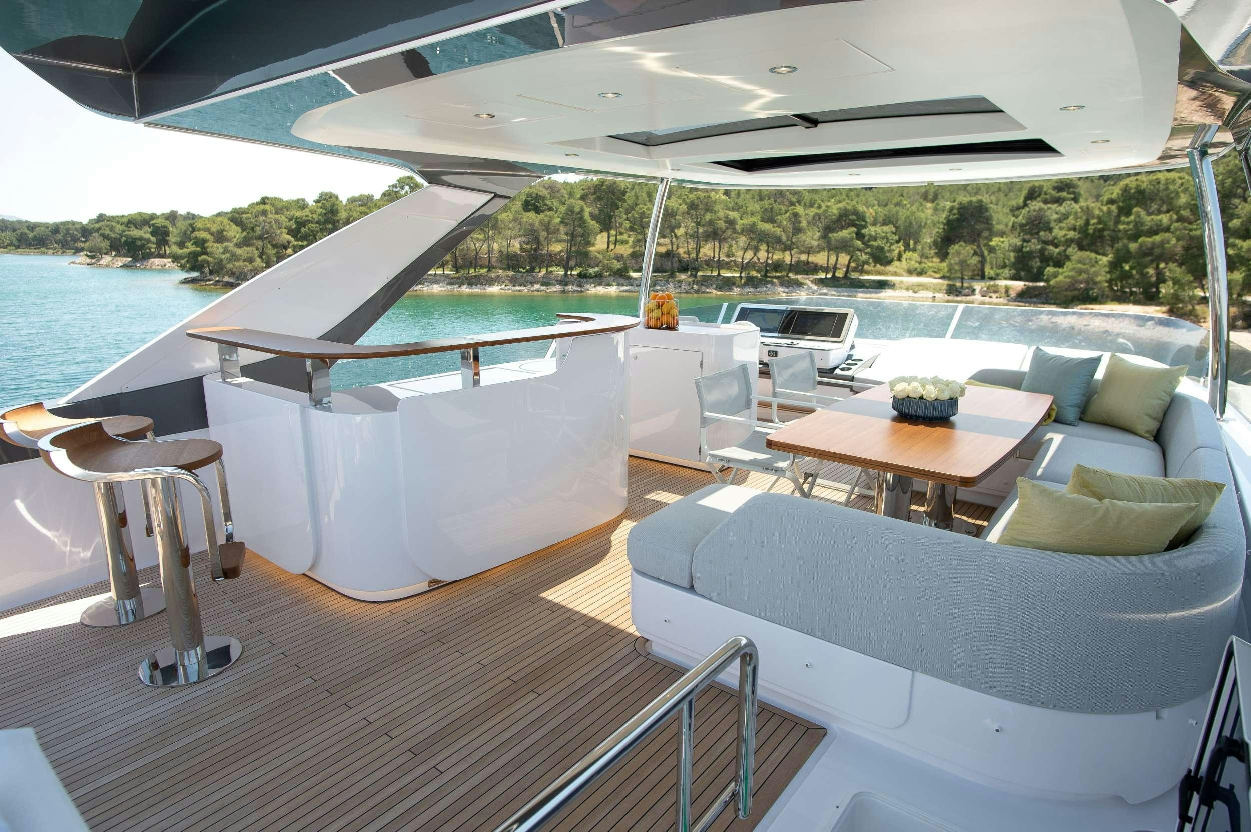 a room with a table and chairs aboard PREWI Yacht for Charter