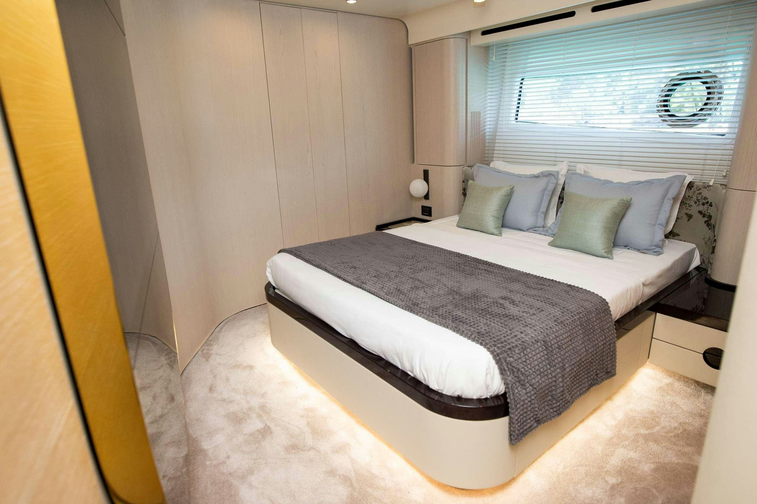 a bed with pillows aboard PREWI Yacht for Charter