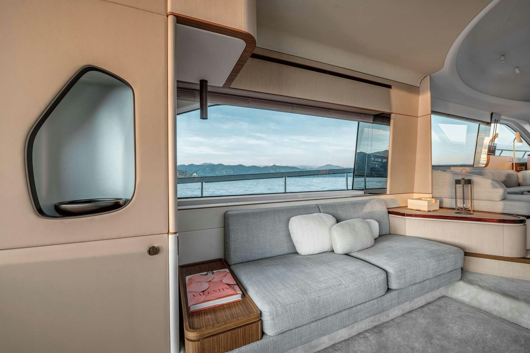 a living room with a large window aboard DONNA Yacht for Charter