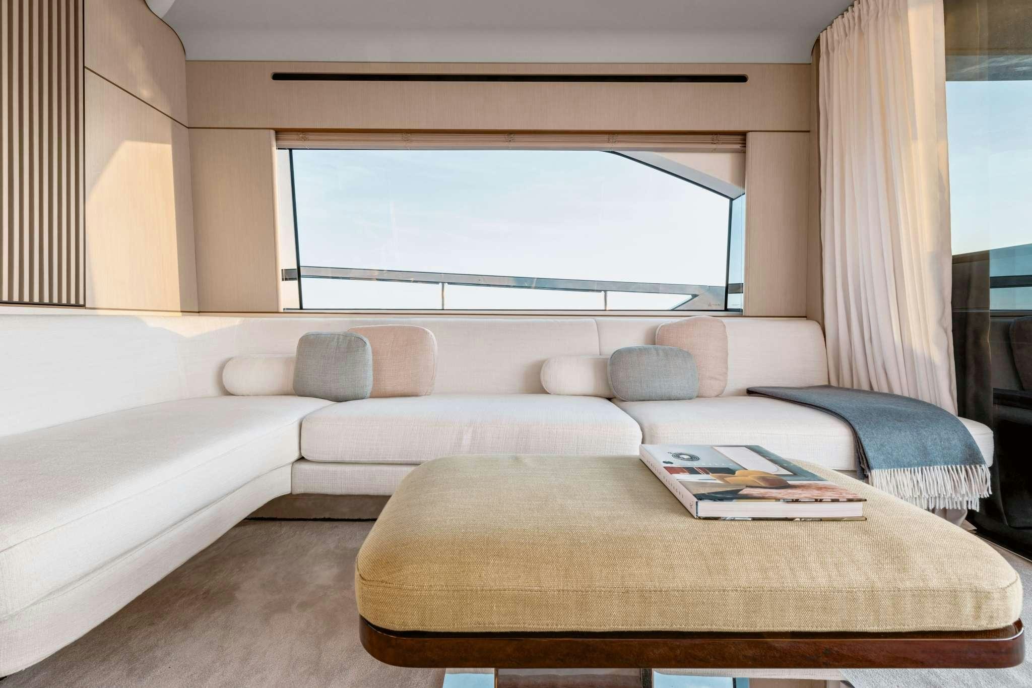 a living room with a couch and a table aboard DONNA Yacht for Charter