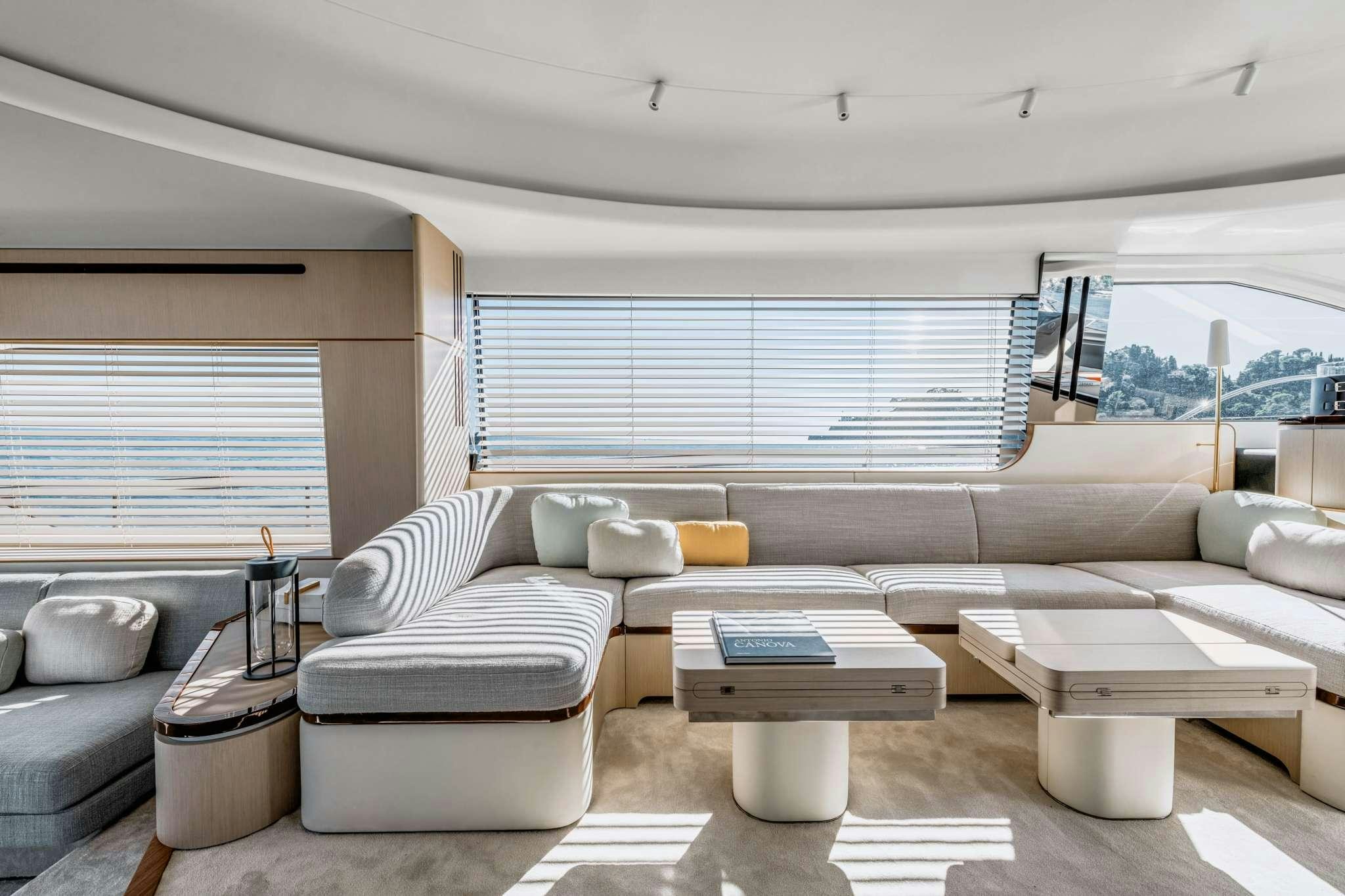a living room with a couch and a table aboard DONNA Yacht for Charter