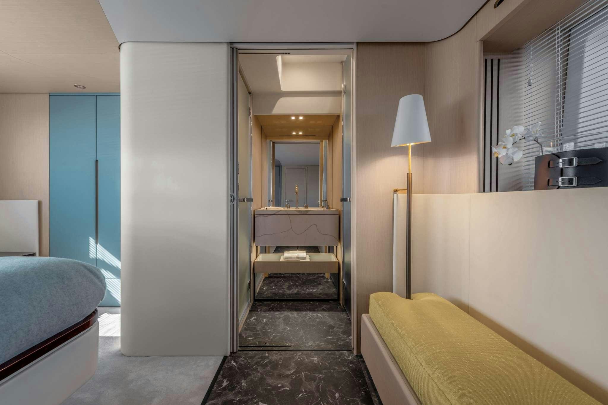 a room with a bed and a desk aboard DONNA Yacht for Charter