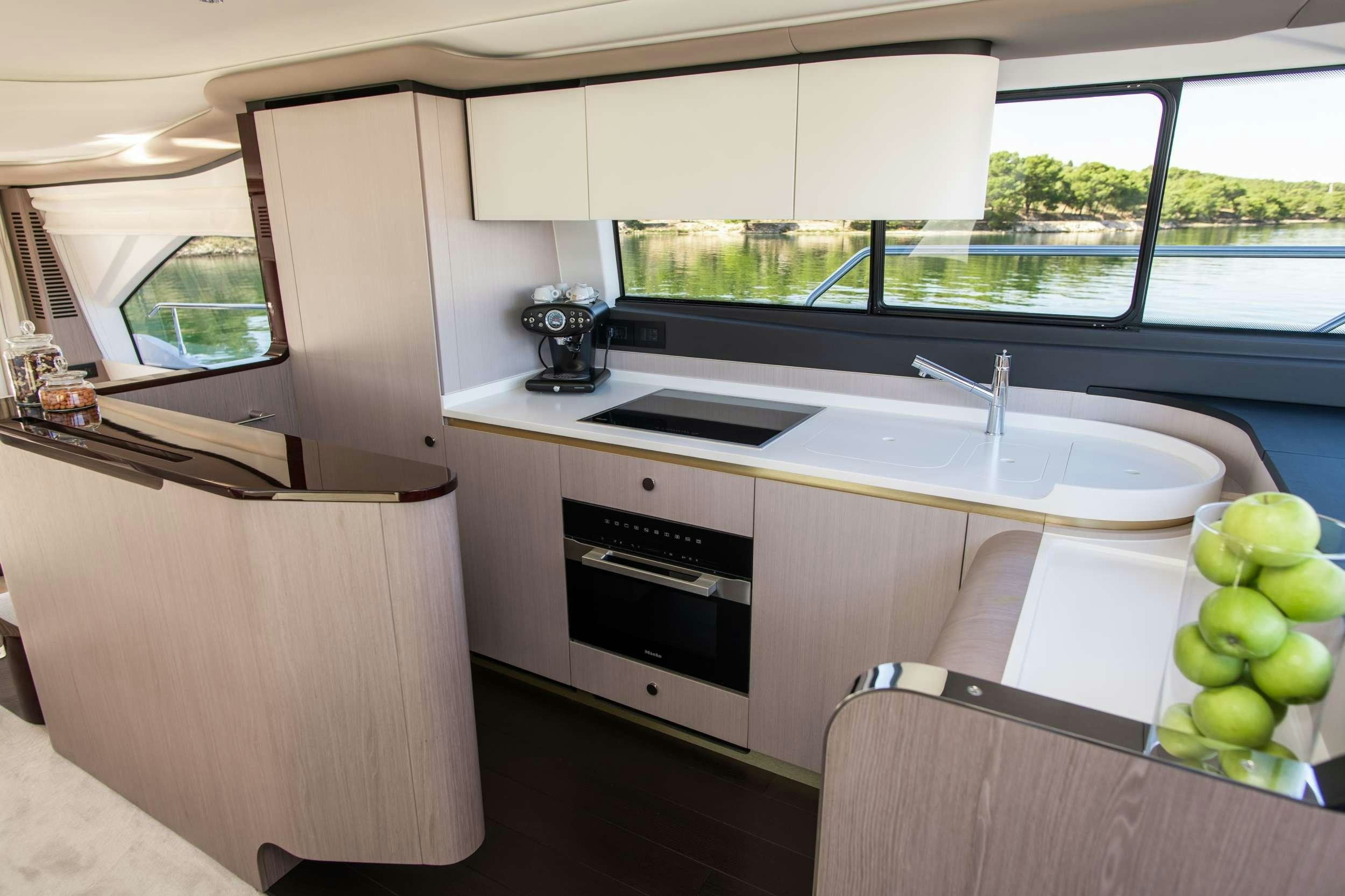 a kitchen with a sink and a stove aboard ALIBABA Yacht for Charter