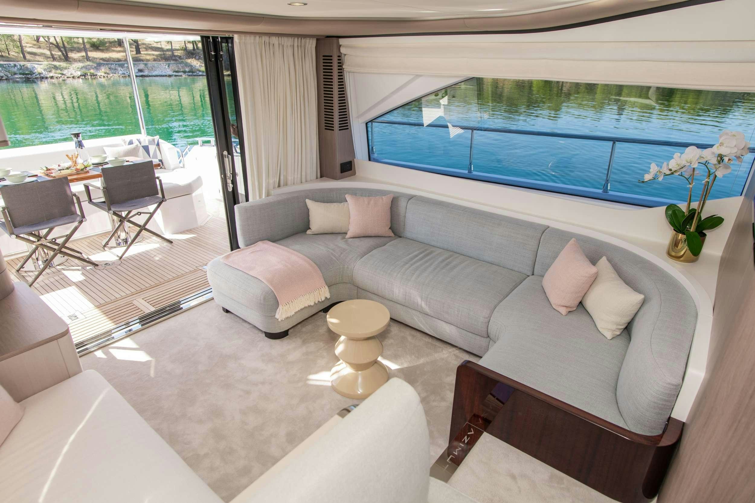 a living room with a large window aboard ALIBABA Yacht for Charter