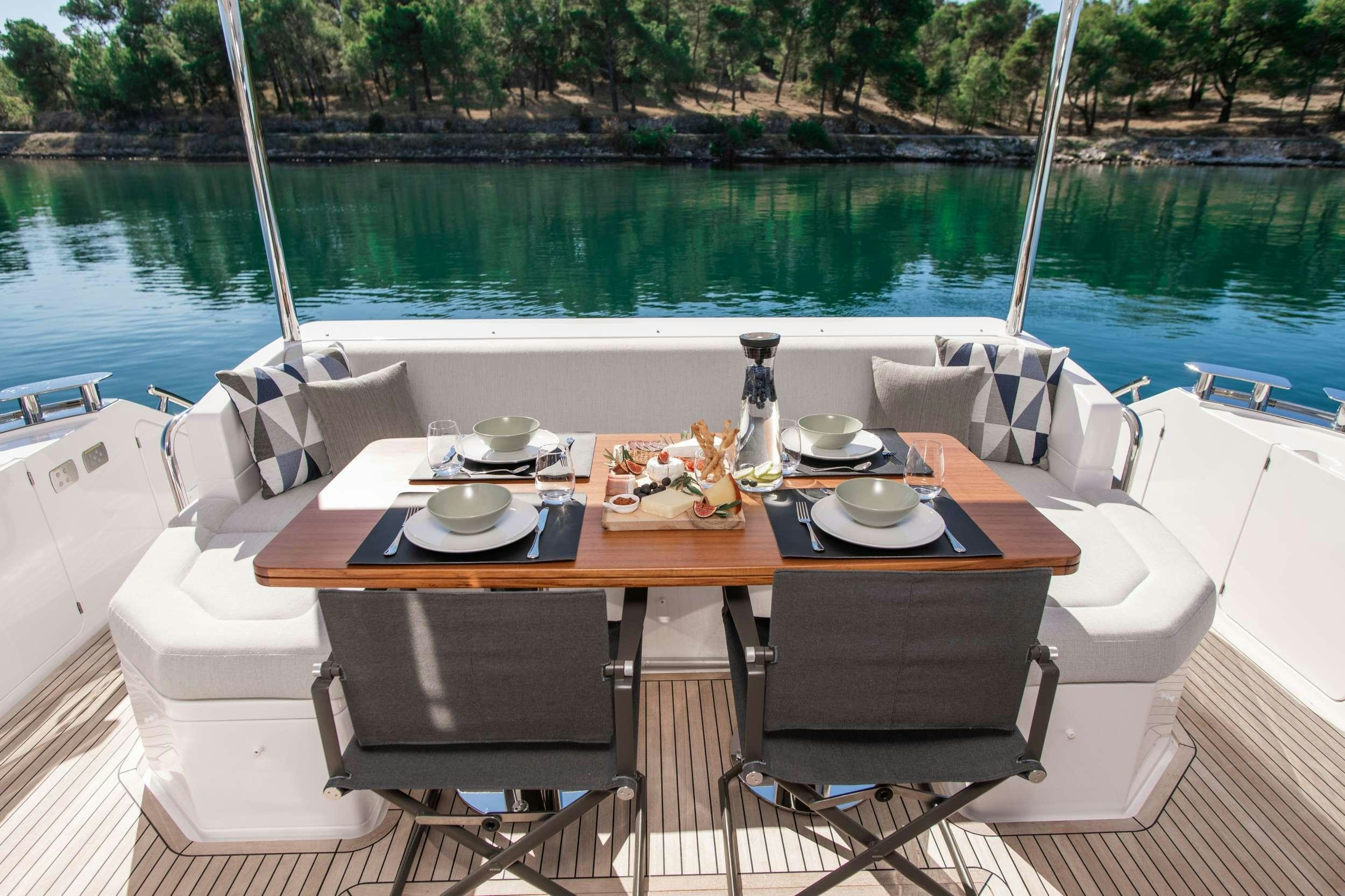 a table on a boat aboard ALIBABA Yacht for Charter