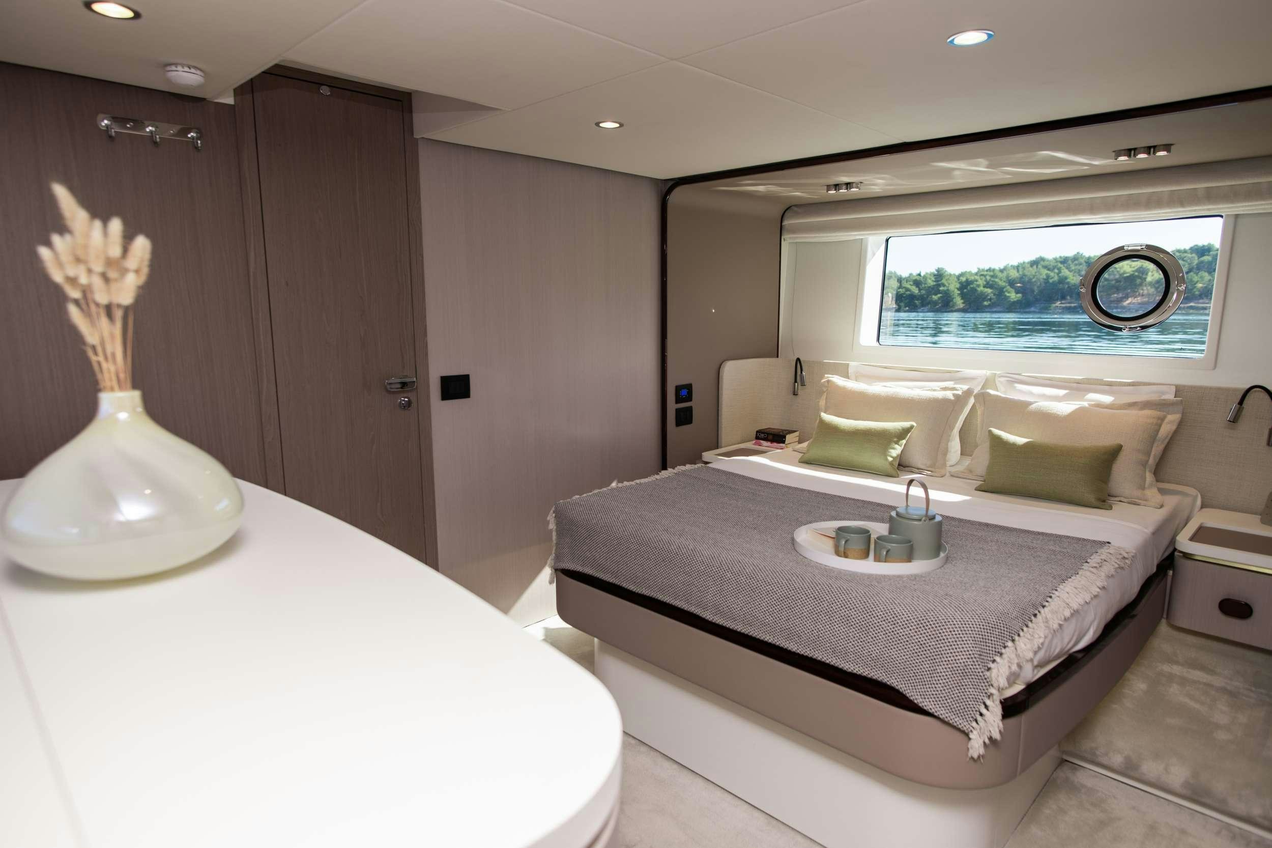 a hotel room with a bed aboard ALIBABA Yacht for Charter
