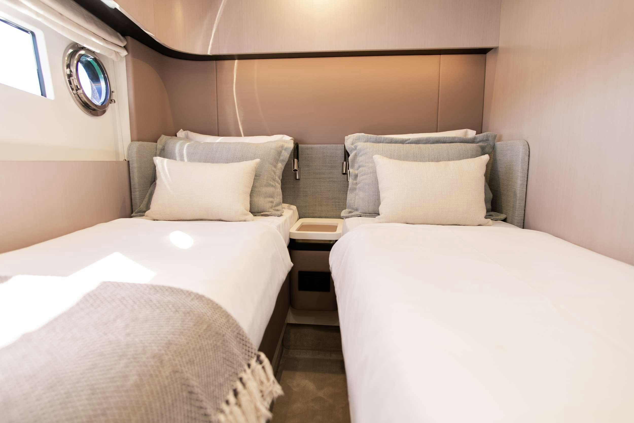 a couple of beds in a room aboard ALIBABA Yacht for Charter
