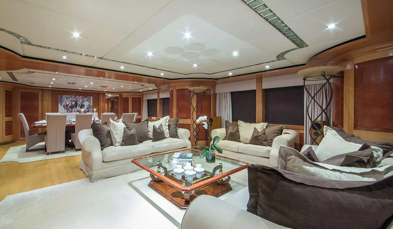 The salon features plush seating and elegant decor, creating a luxurious and comfortable atmosphere. aboard MAC BREW Yacht for Charter