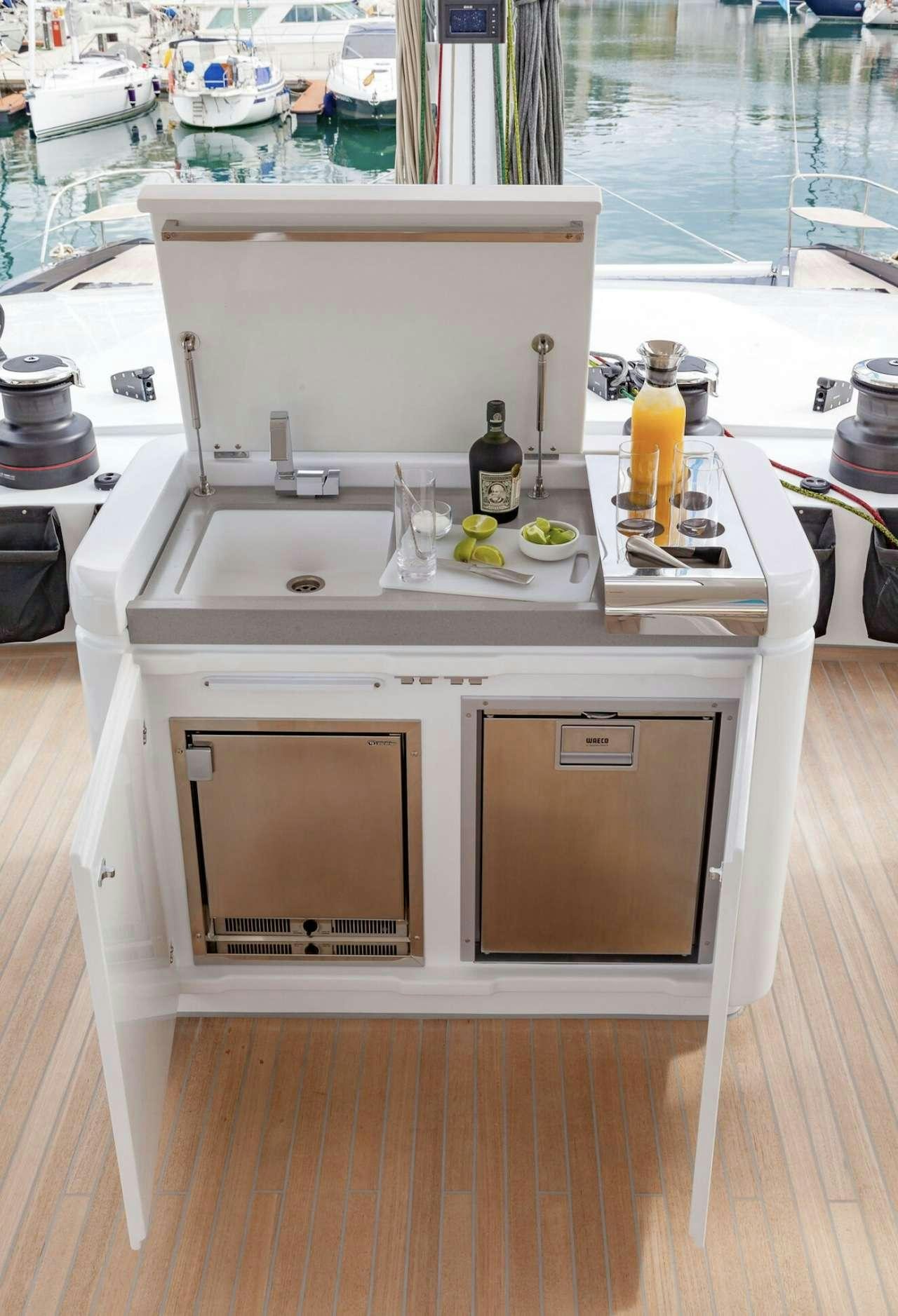 a kitchen with a microwave oven aboard AEOLUS 77 Yacht for Charter