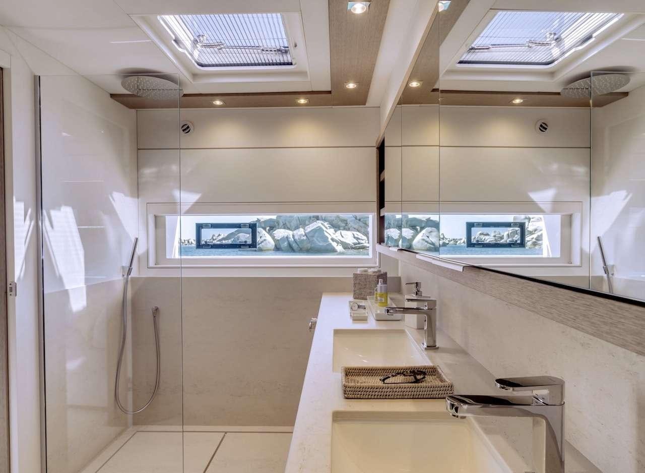 a kitchen with a large window aboard AEOLUS 77 Yacht for Charter