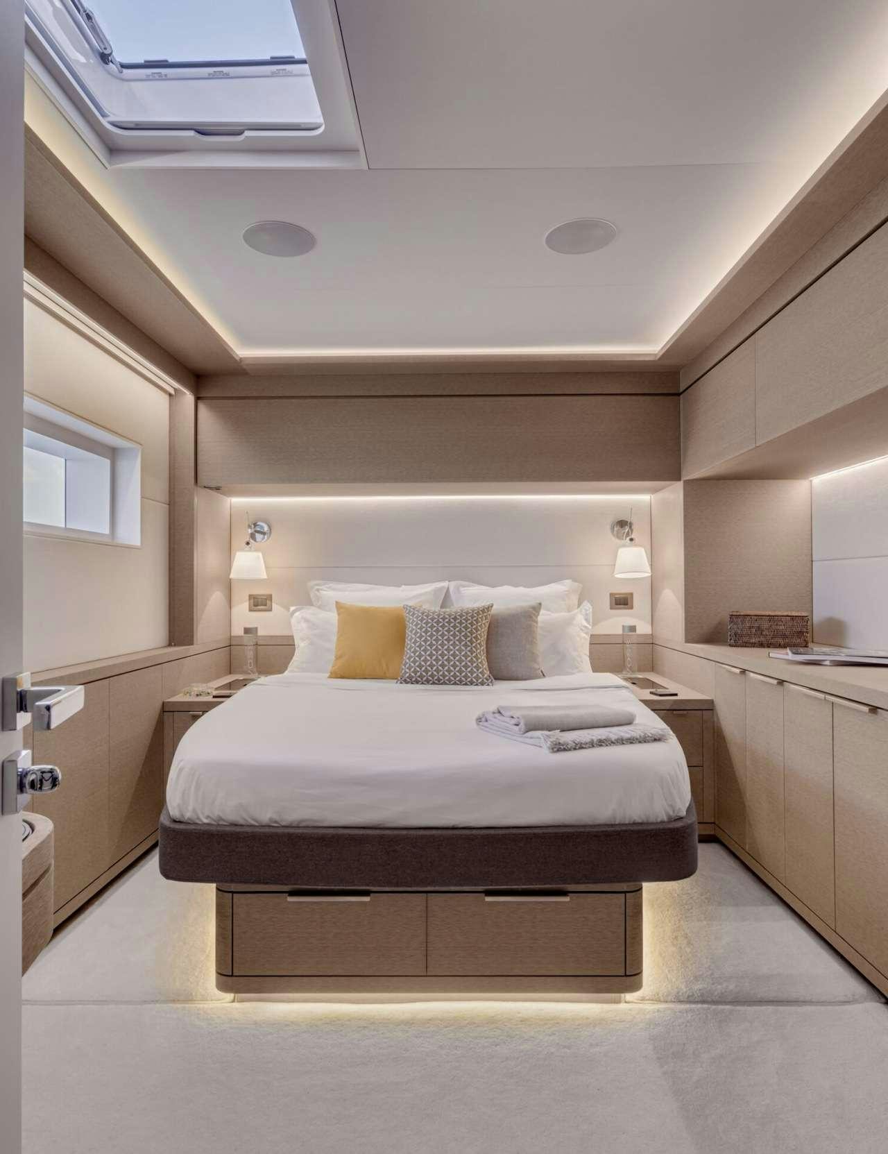 a bed in a room aboard AEOLUS 77 Yacht for Charter