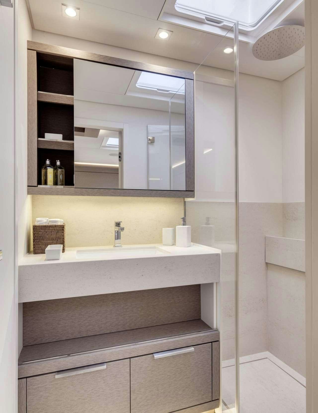 a bathroom with a sink and cabinets aboard AEOLUS 77 Yacht for Charter