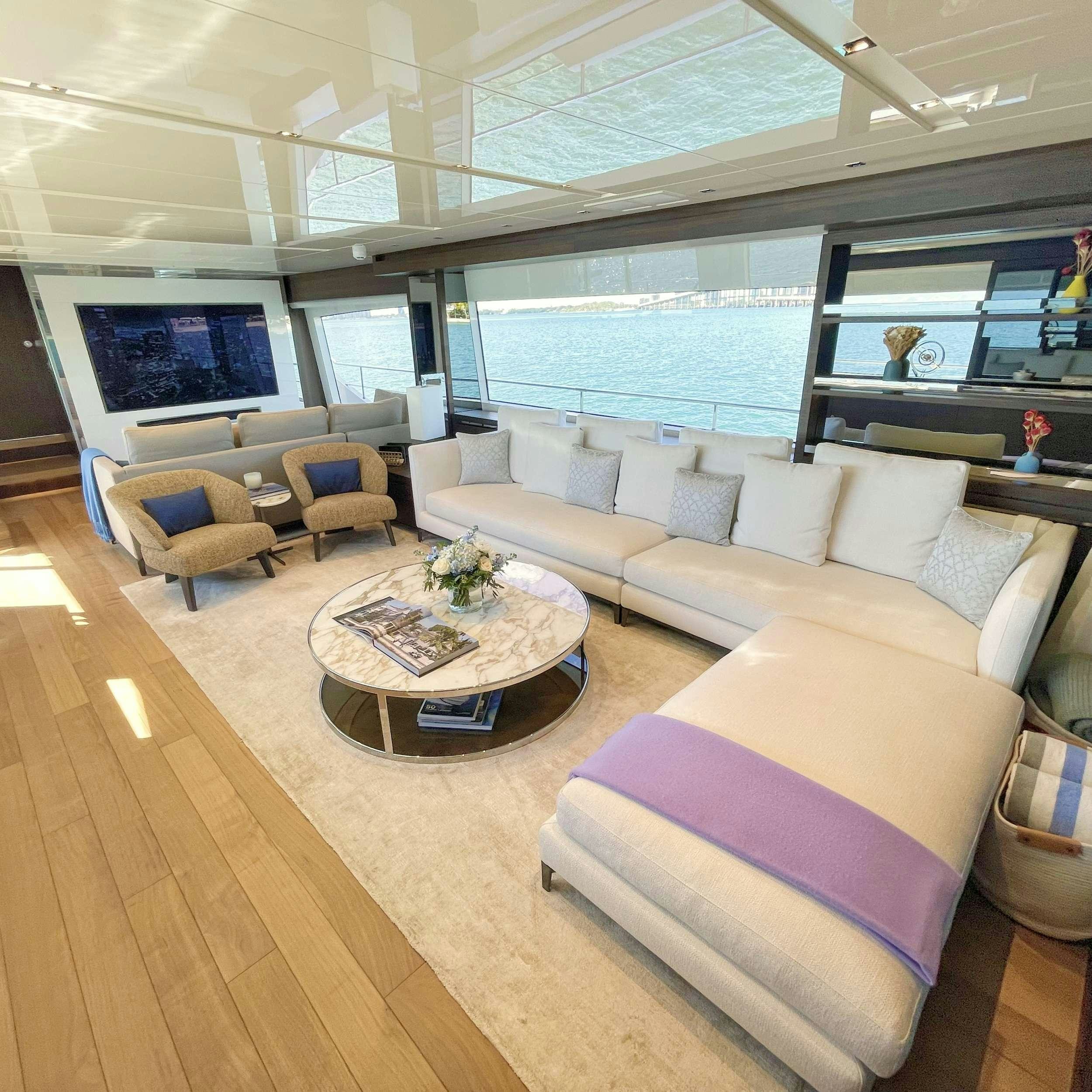 a living room with a large window aboard C-DAZE Yacht for Charter