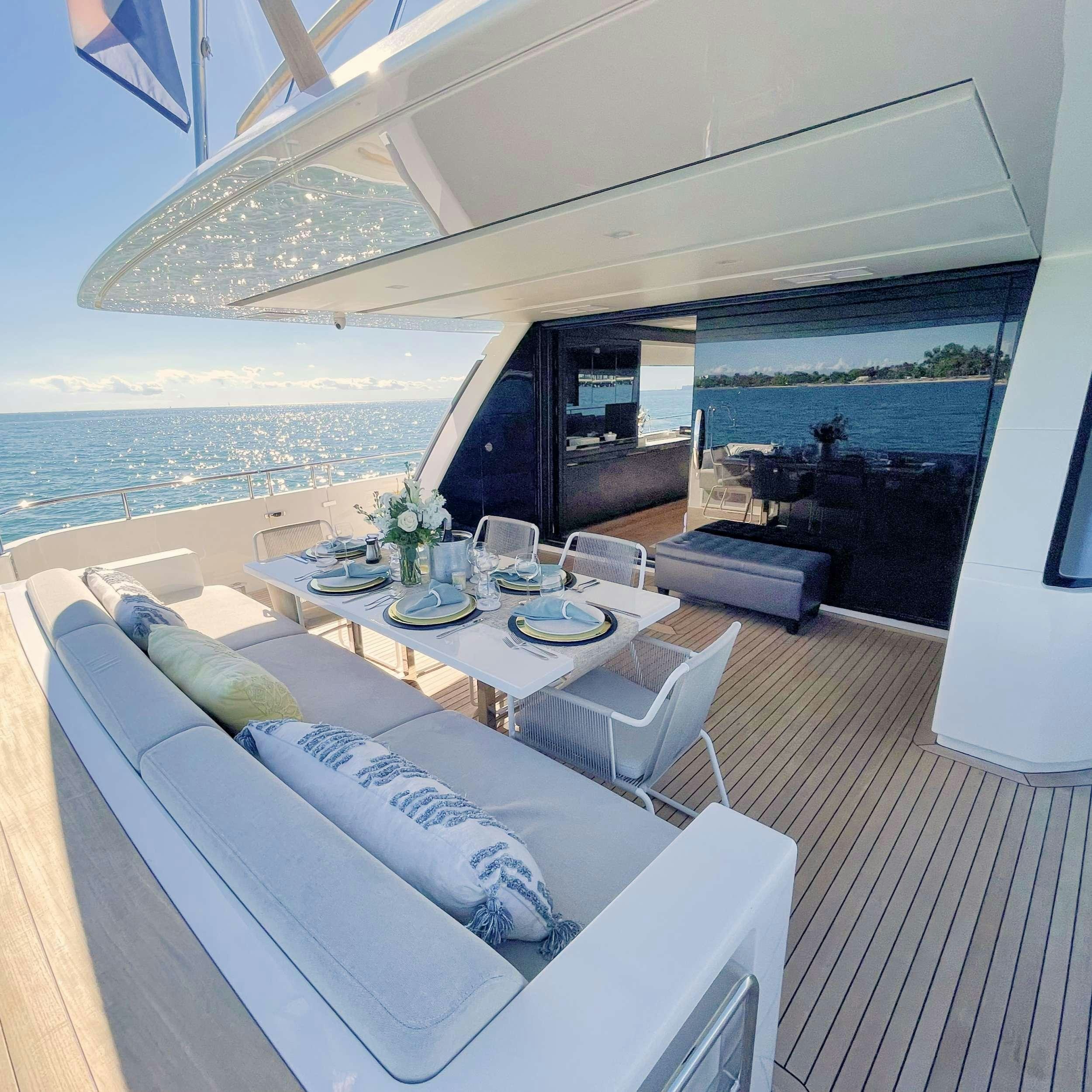 a modern living room with a large body of water aboard C-DAZE Yacht for Charter