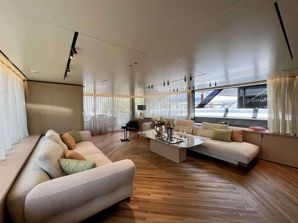 a living room with a wood floor aboard EM3 Yacht for Charter