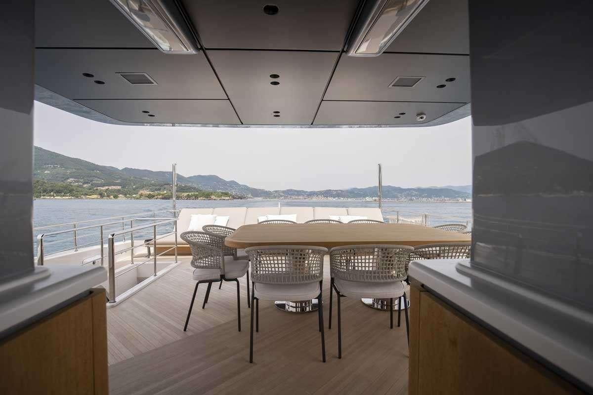 a room with a table and chairs aboard EM3 Yacht for Charter