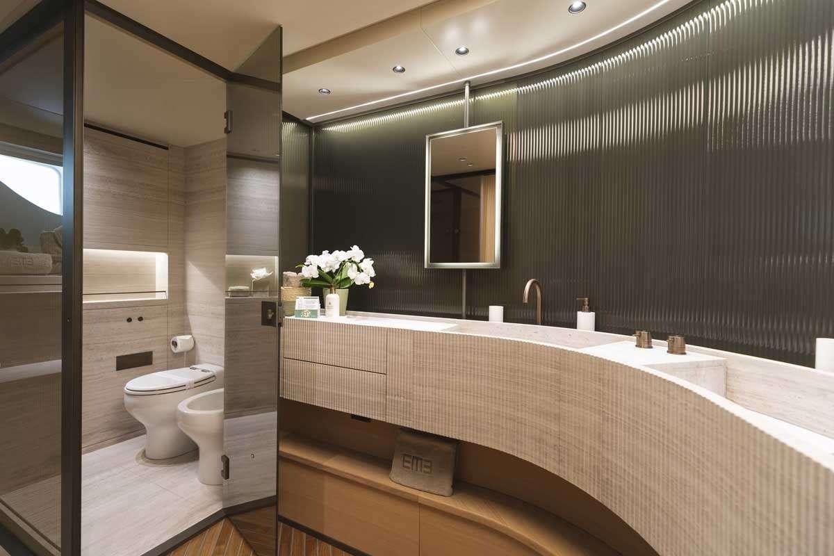 a bathroom with a large mirror aboard EM3 Yacht for Charter