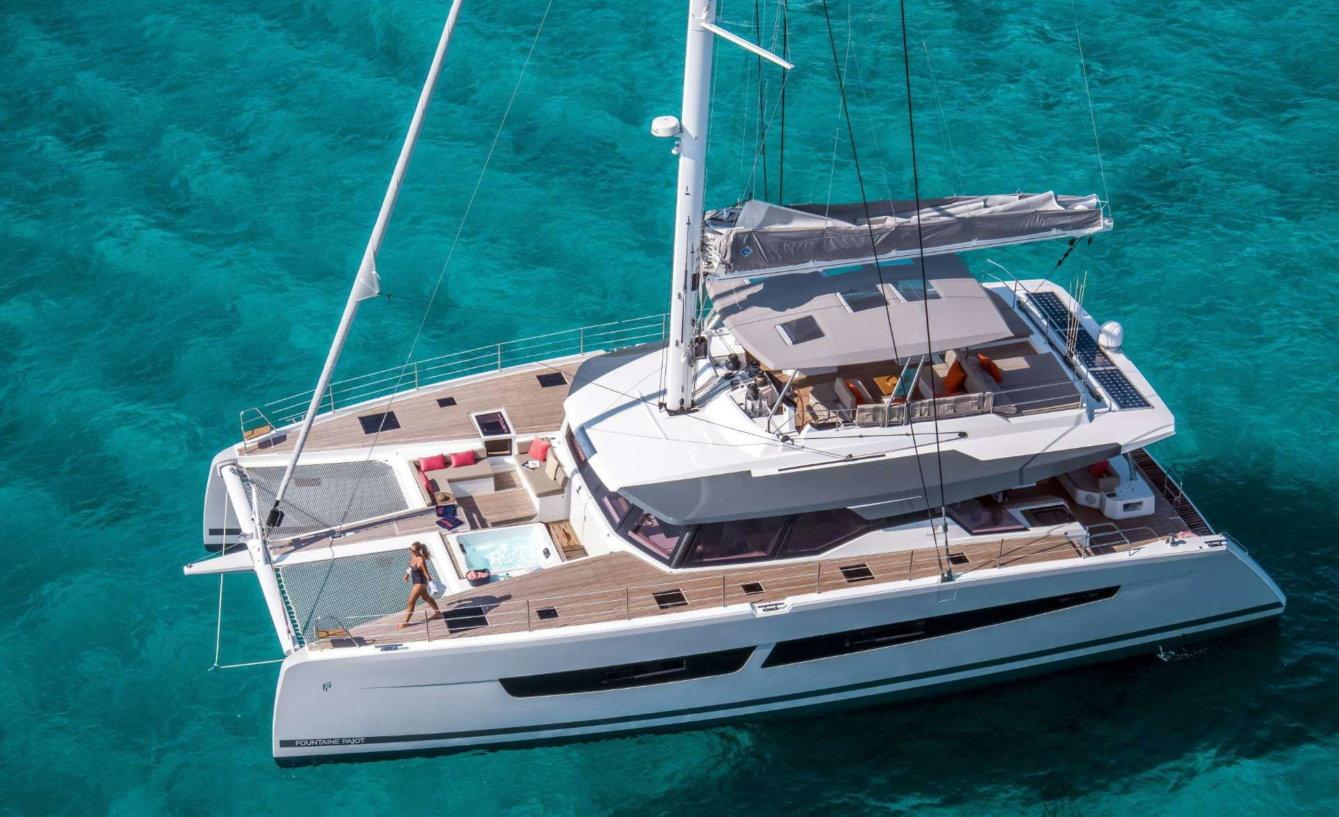 a white boat on the water aboard YELLOW Yacht for Charter