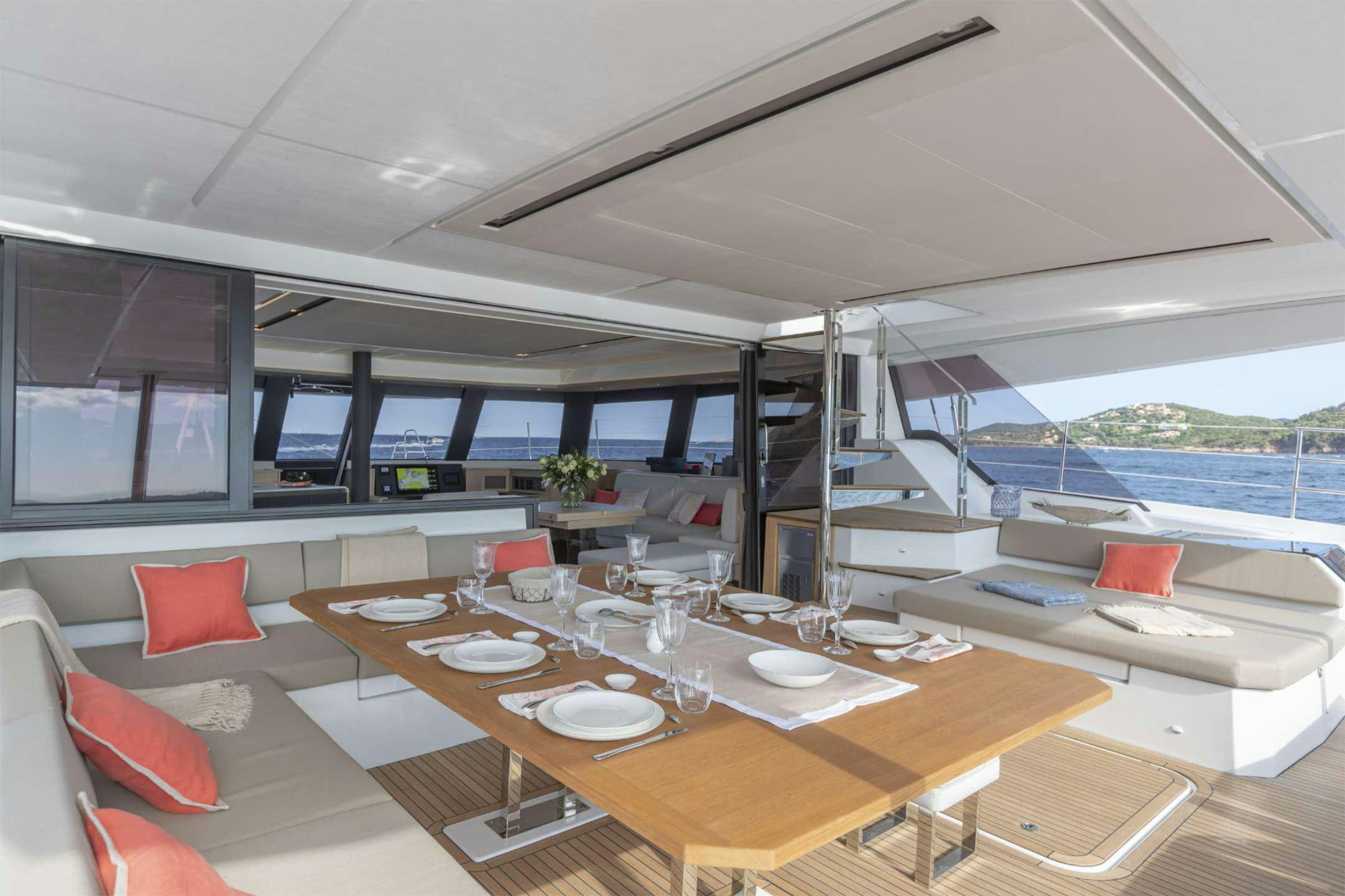 a room with a table and chairs aboard YELLOW Yacht for Charter