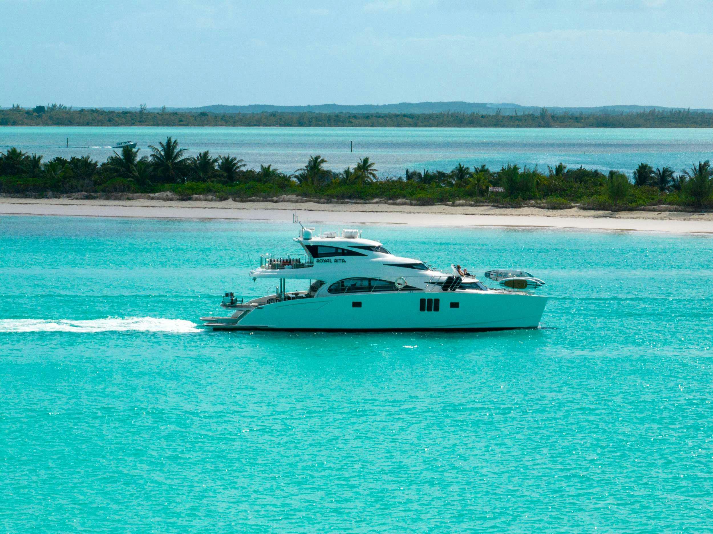 a white boat on the water aboard ROYAL RITA Yacht for Charter